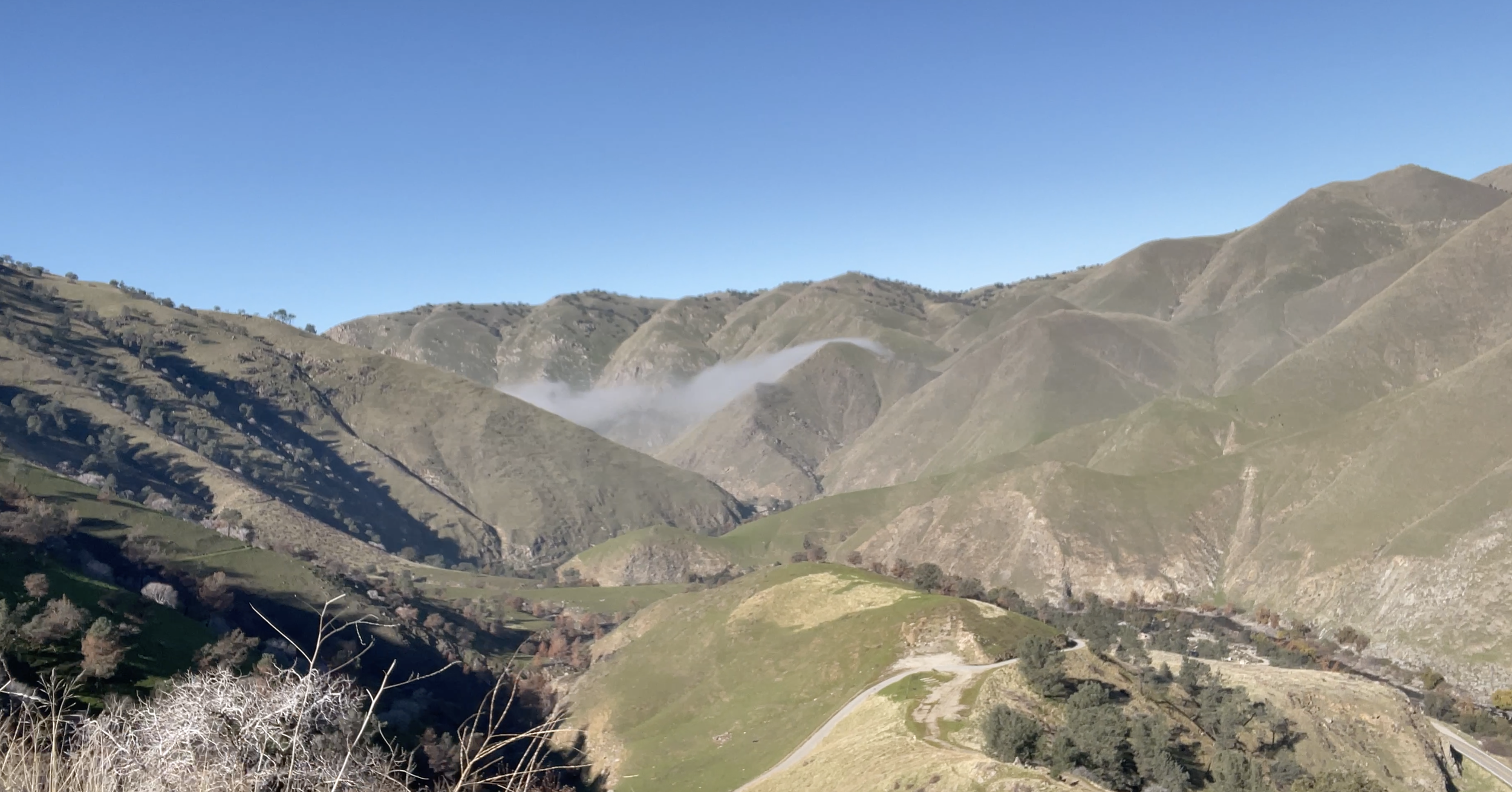 The view of a mountain and canyons.