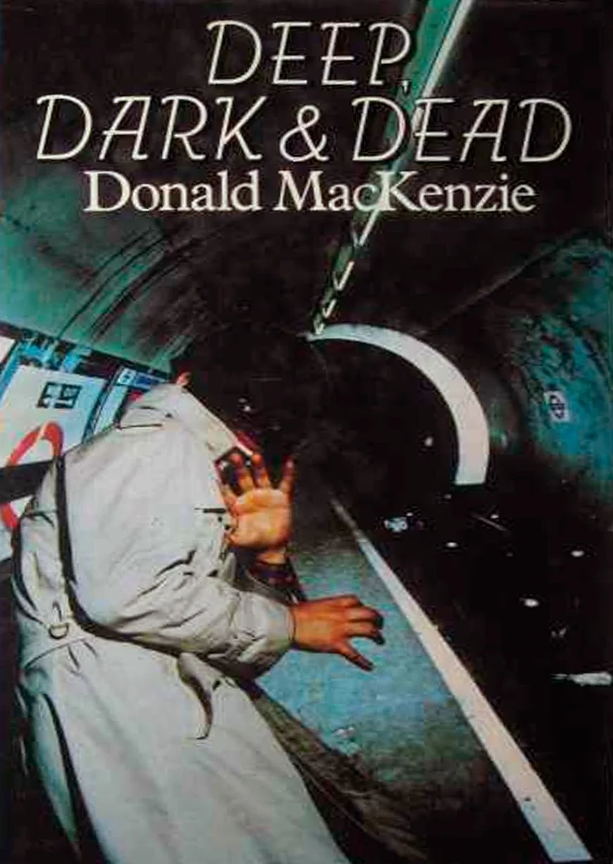 Book cover titled 'Deep, Dark & Dead' by Donald MacKenzie, featuring an illustration of a person waving inside a dark, curved tunnel or sewer pipe.