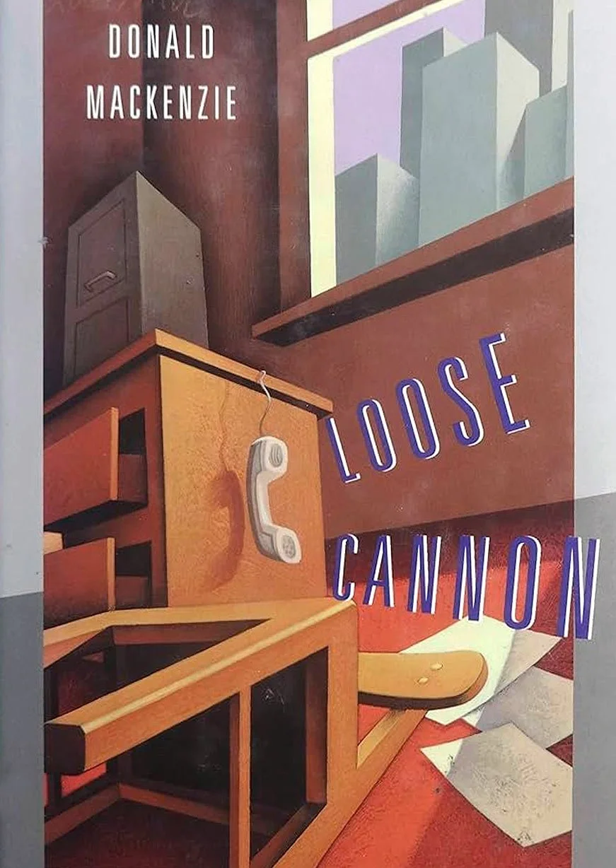 Illustration of an interior scene with office furniture, a landline phone hanging on a cubicle, papers on the floor, a window with city buildings outside, and text reading 'Donald Mackenzie' and 'Loose Cannon'.