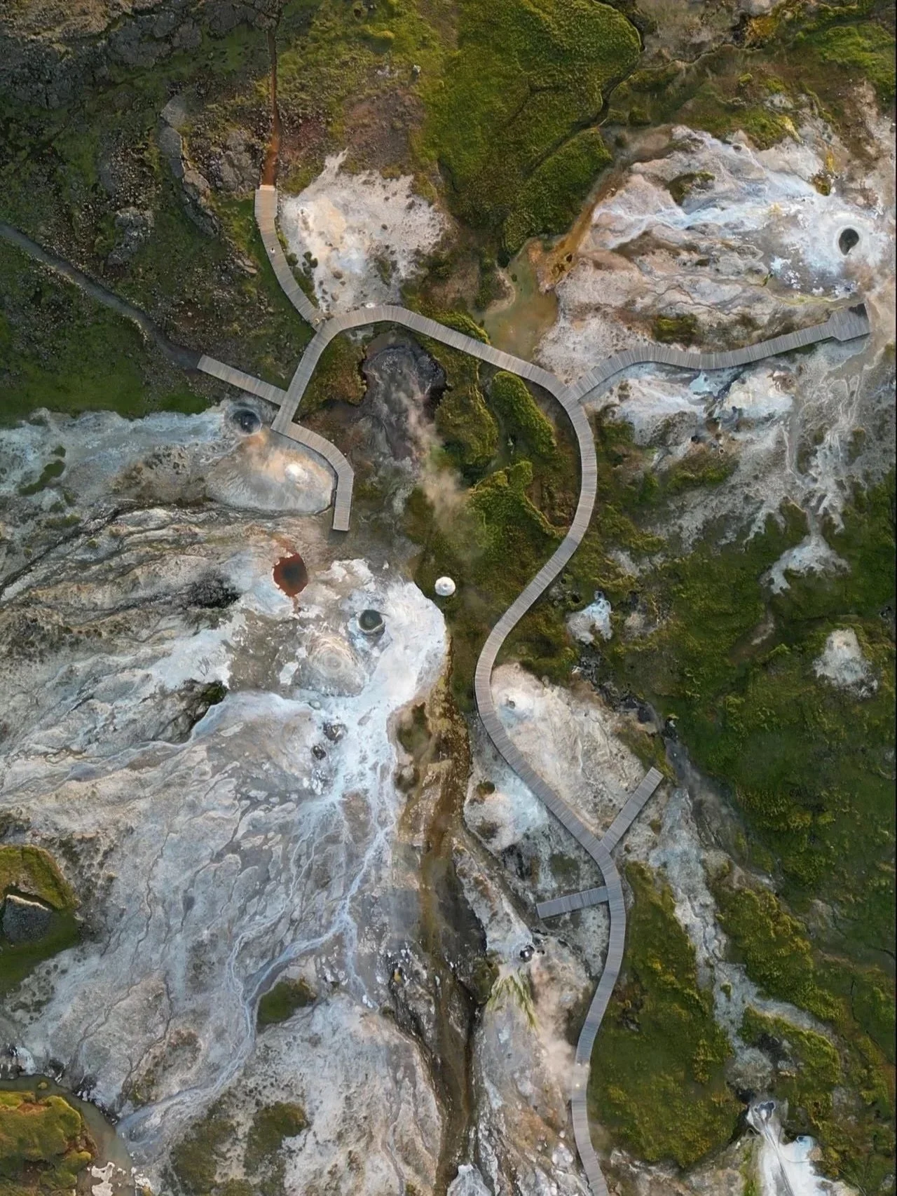 Aerial view of a geothermal terrain and hot springs in the heart of Iceland