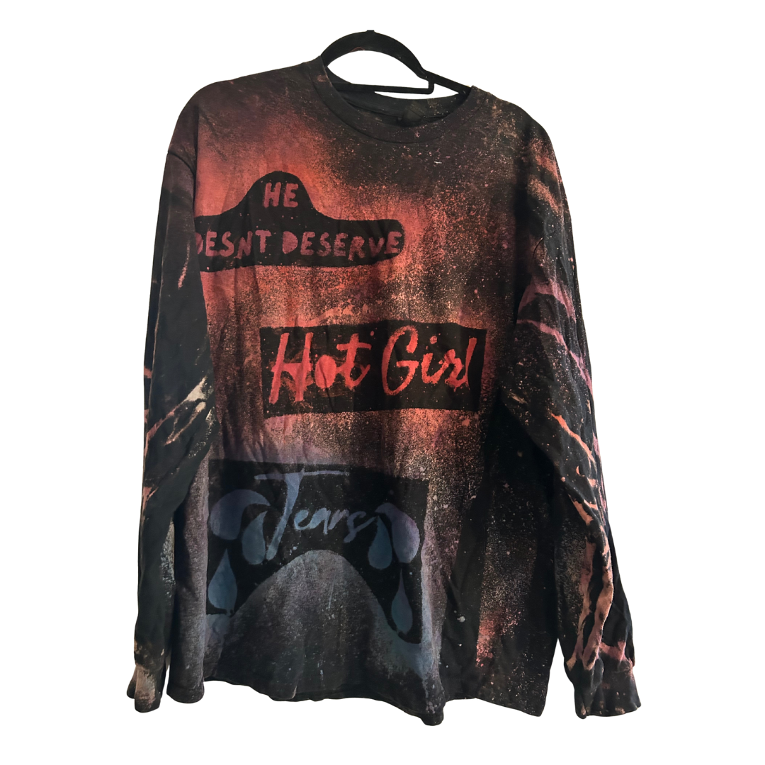 Long-sleeve hand bleach dyed black shirt with the words "He doesn't deserve hot girl tears" dyed in and then re-colored (colored dye added into the bleach space). Made for Women to remind women of their power