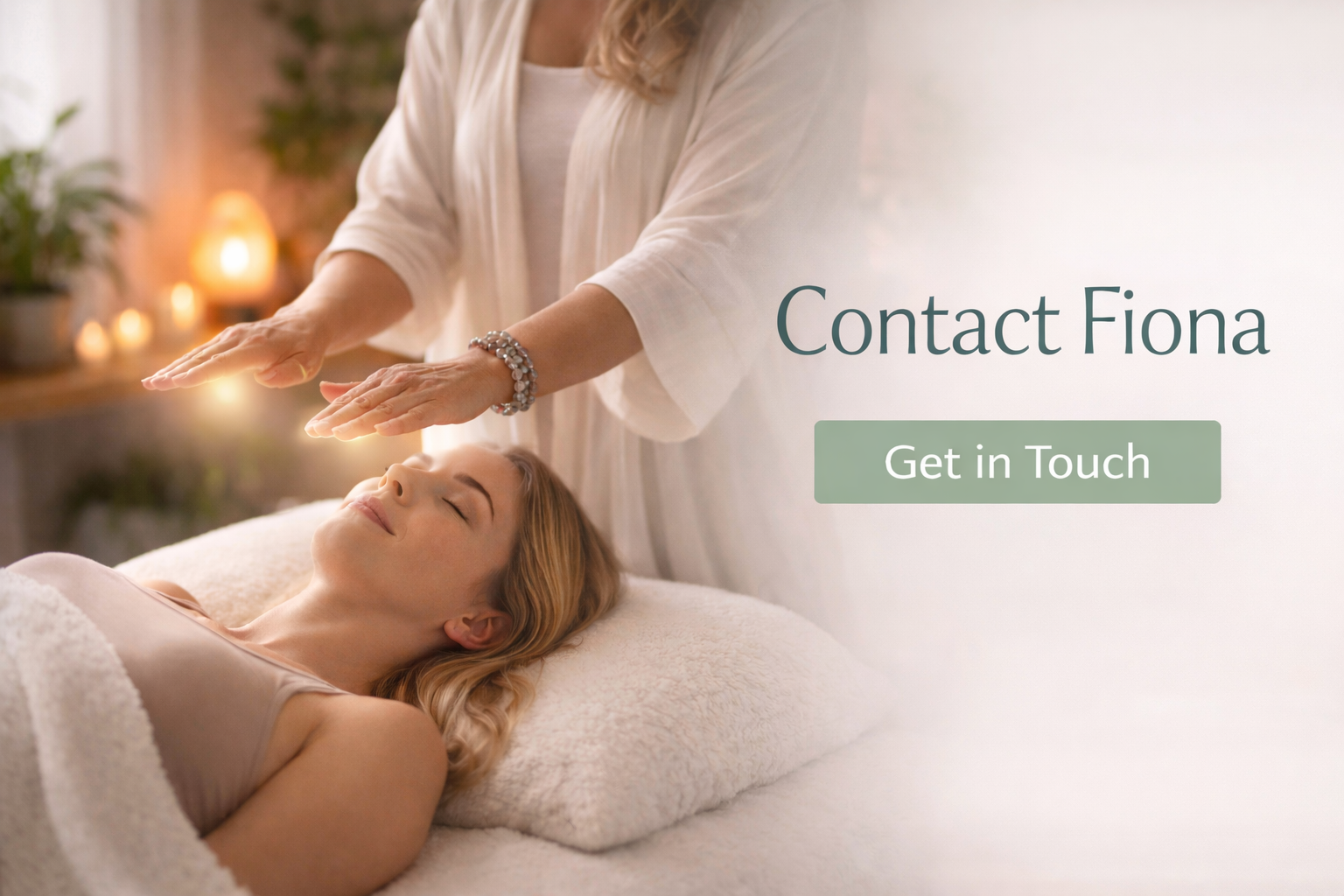 A woman lying on a massage table receiving a Reiki or energy healing session from a practitioner in a softly lit room with candles and plants, with overlay text saying "Contact Fiona" and a button "Get in Touch."
