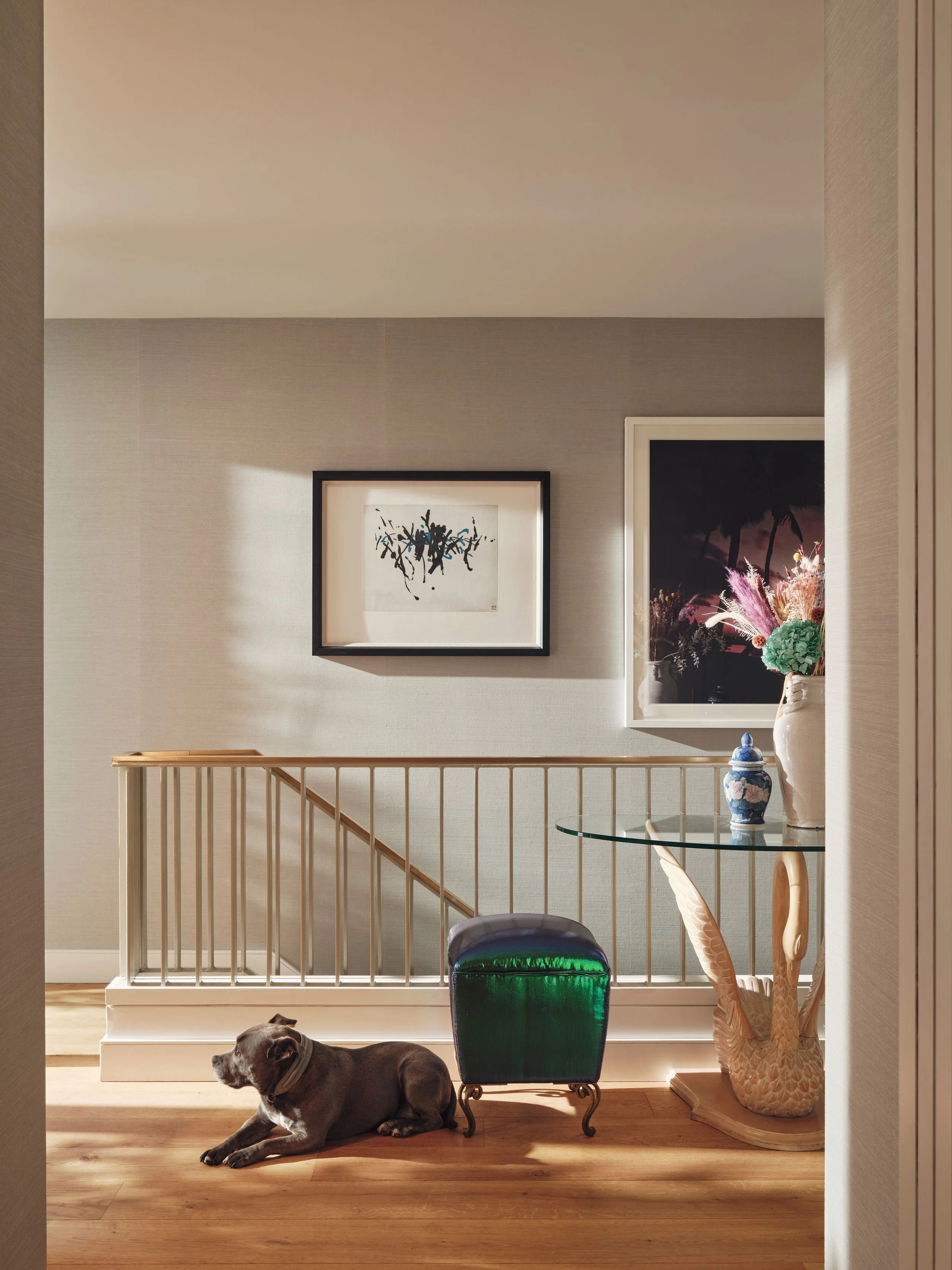 Hollywood Regency hallway with Schumacher wallpaper in Westminster duplex designed by Studio L London