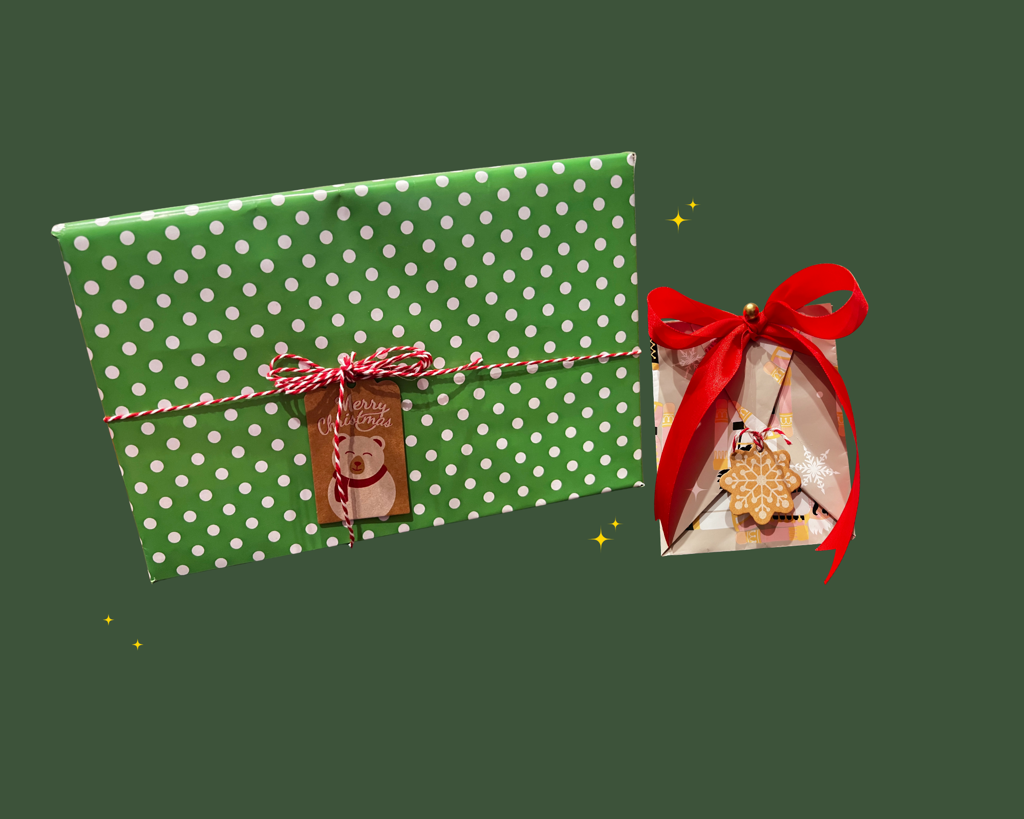 Two Christmas gift boxes on a dark green background. The larger box is wrapped in green paper with white polka dots, decorated with a red and white string, and a tag that says "Merry Christmas" with a bear illustration. The smaller box is wrapped in paper with holiday designs, tied with a red ribbon, and has a gingerbread cookie ornament hanging from it.