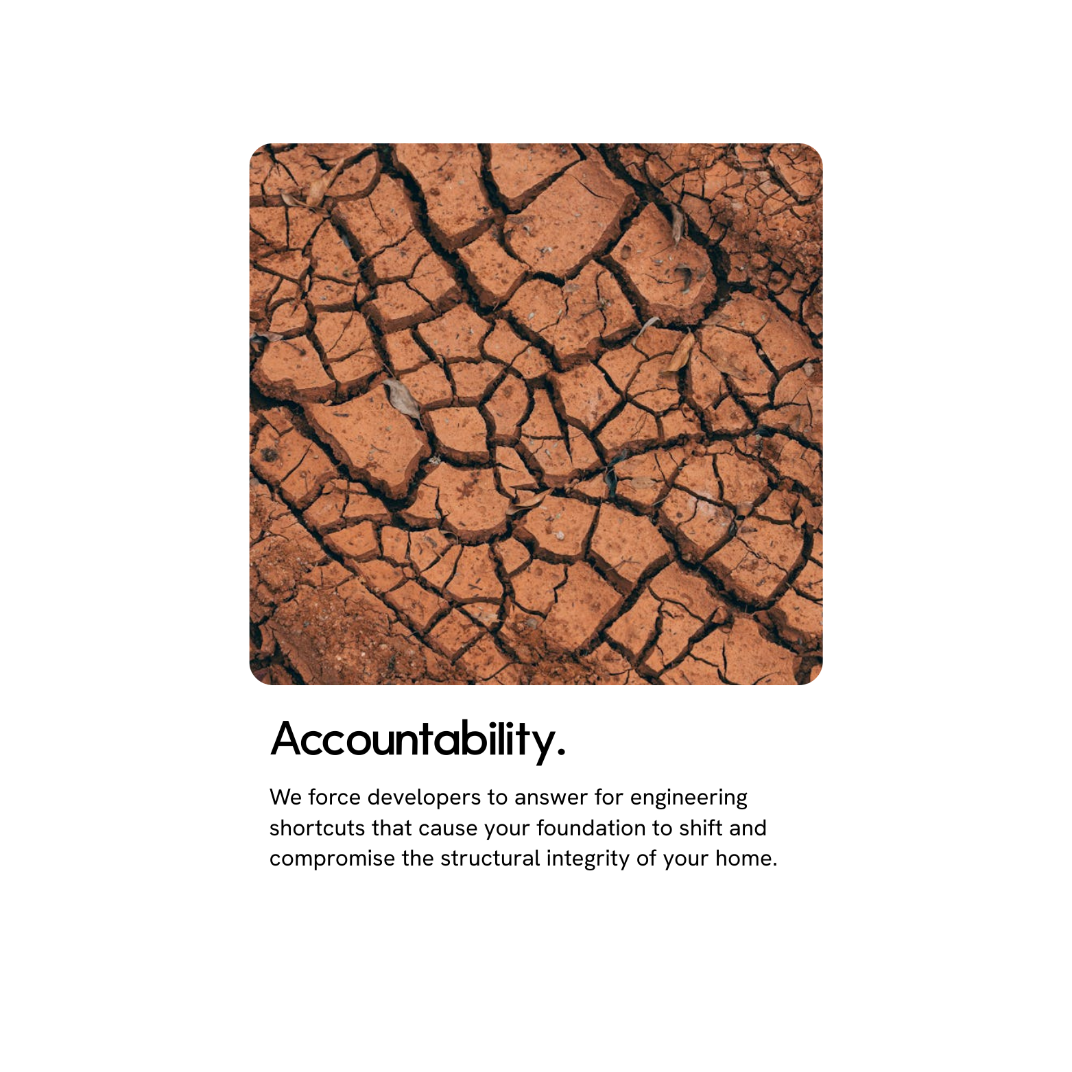 Close-up of cracked dry earth with reddish soil.