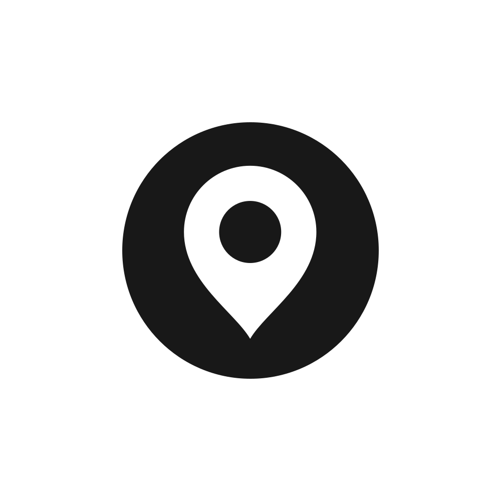 Black icon with a white location pin symbol on a black background.