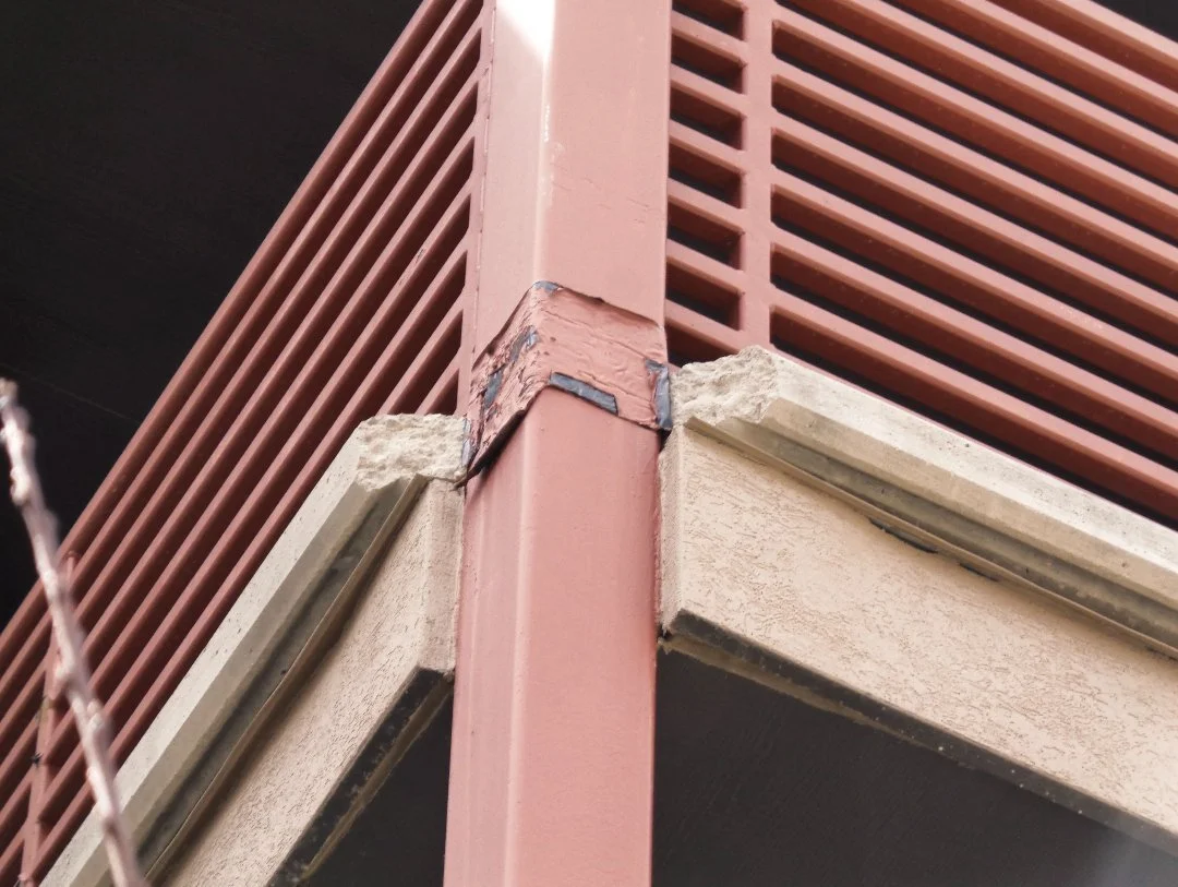 A close up image of damage on a railing.