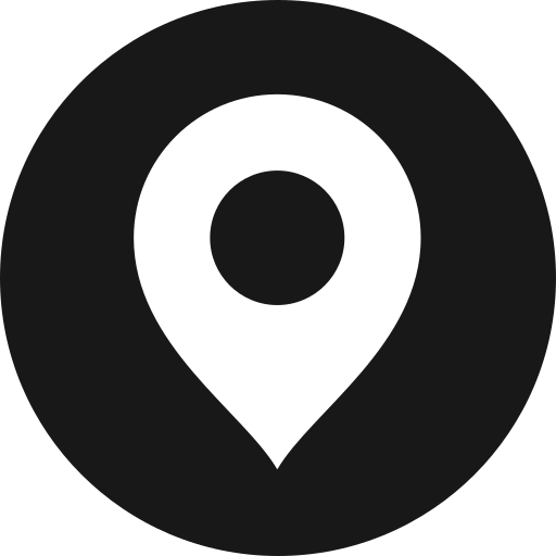 Black location pin icon on a black background.