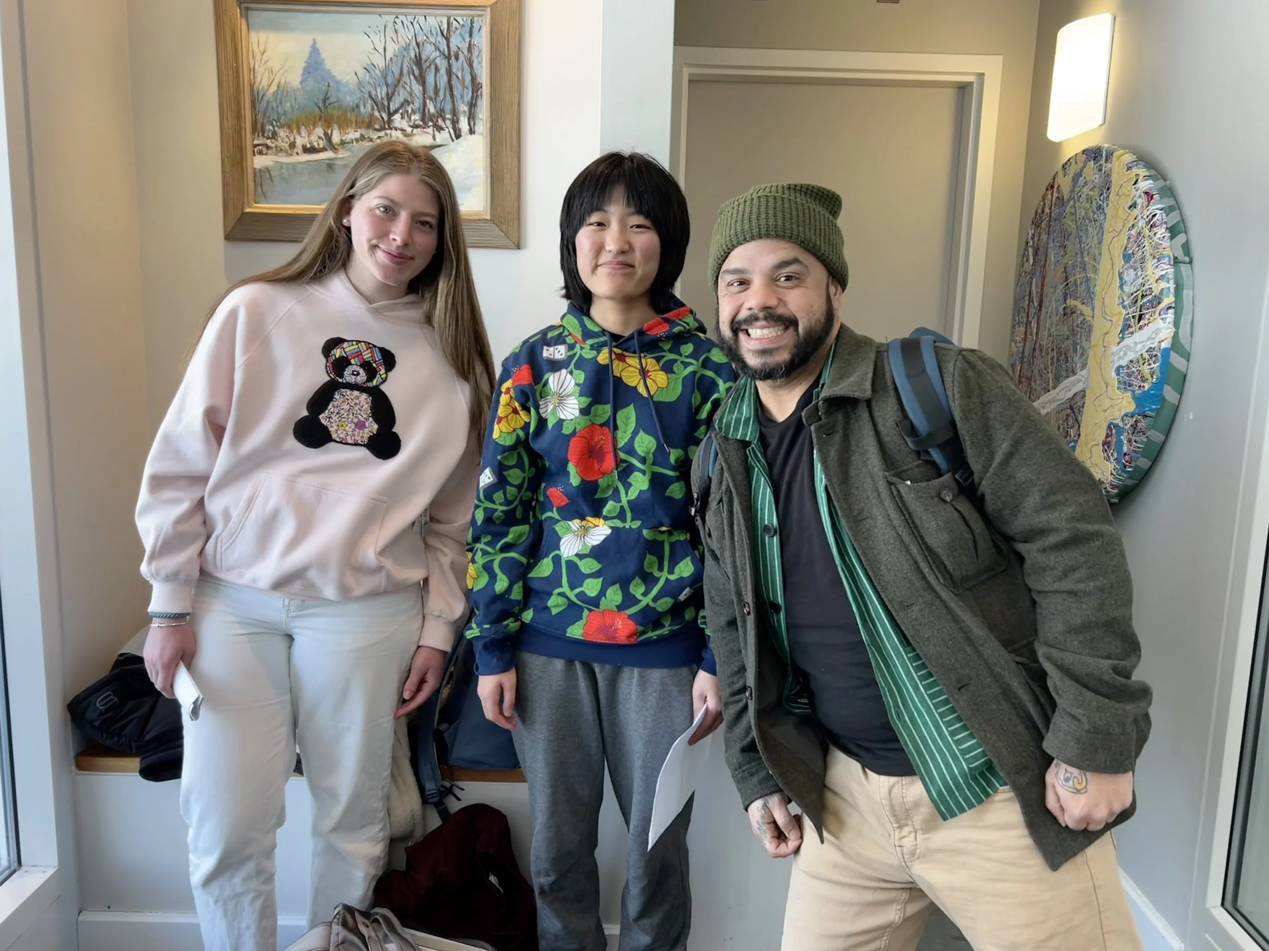 Roberto with interns who are wearing RL designed merchandise from the pop-up shop