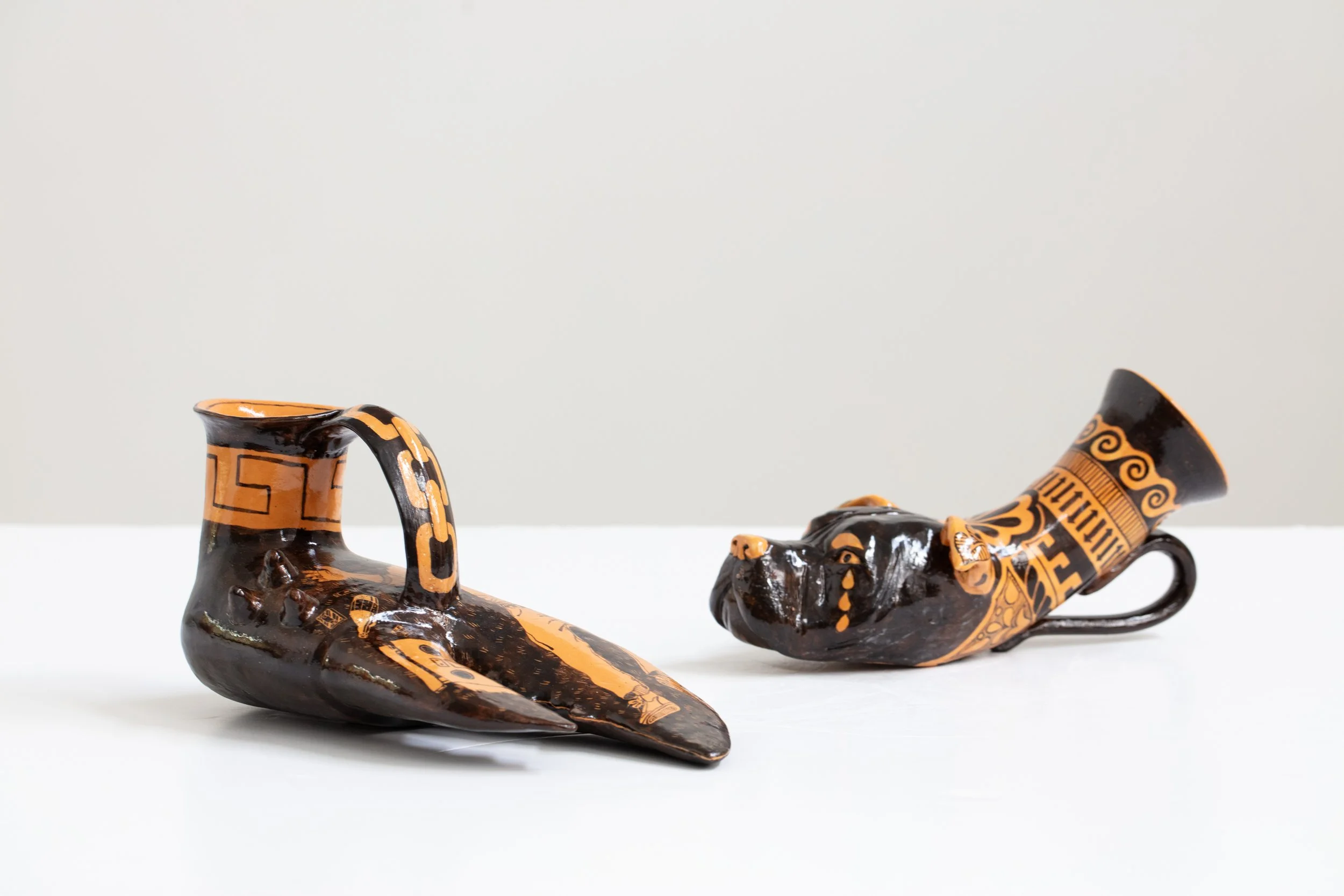Roberto Lugo: Untitled (Pitbull) Rhyton. 2024. Glazed stoneware. 6.25" (H) x 12" (W) x 6" (D)