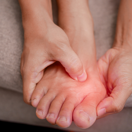 A person massaging or pressing on the sole of a child's foot.
