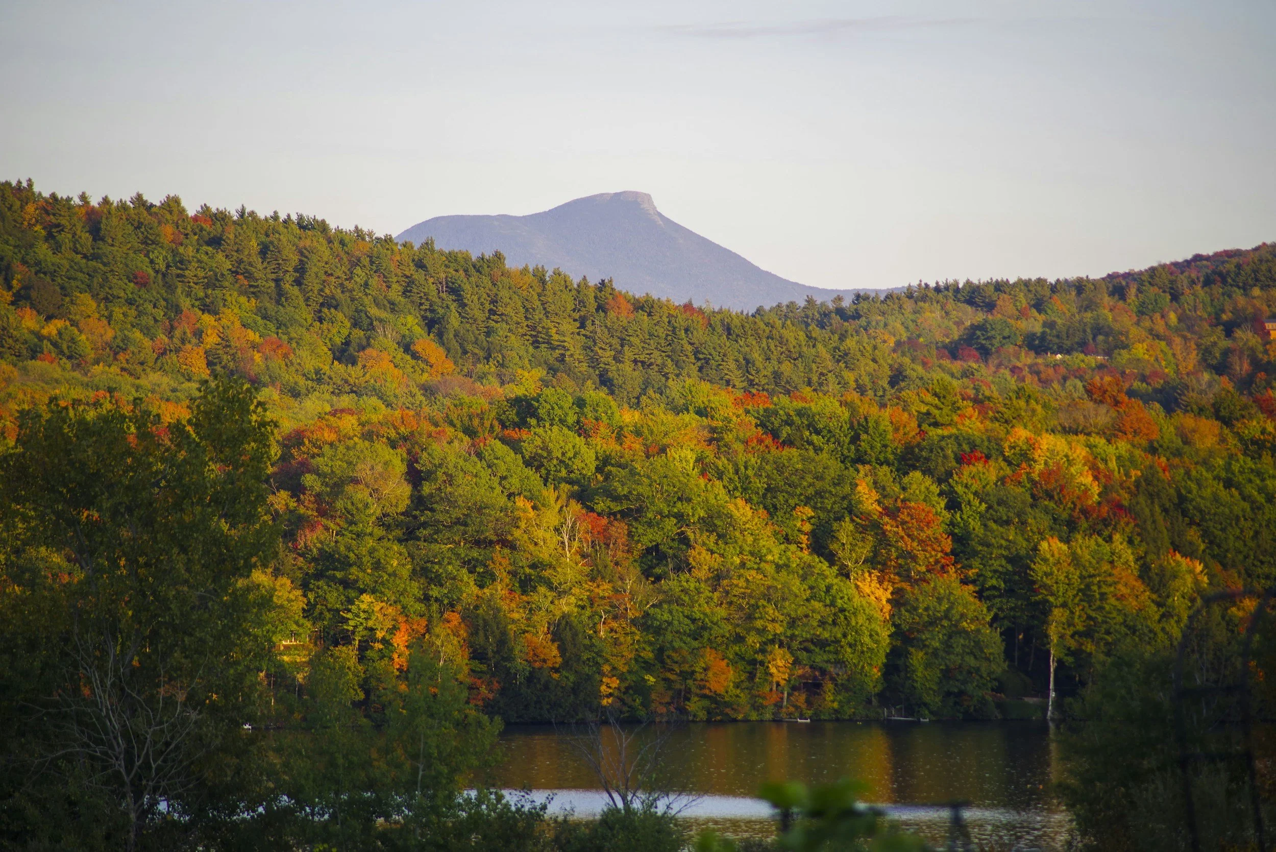 Camels Hump Mountain with fall foliage colors and pond