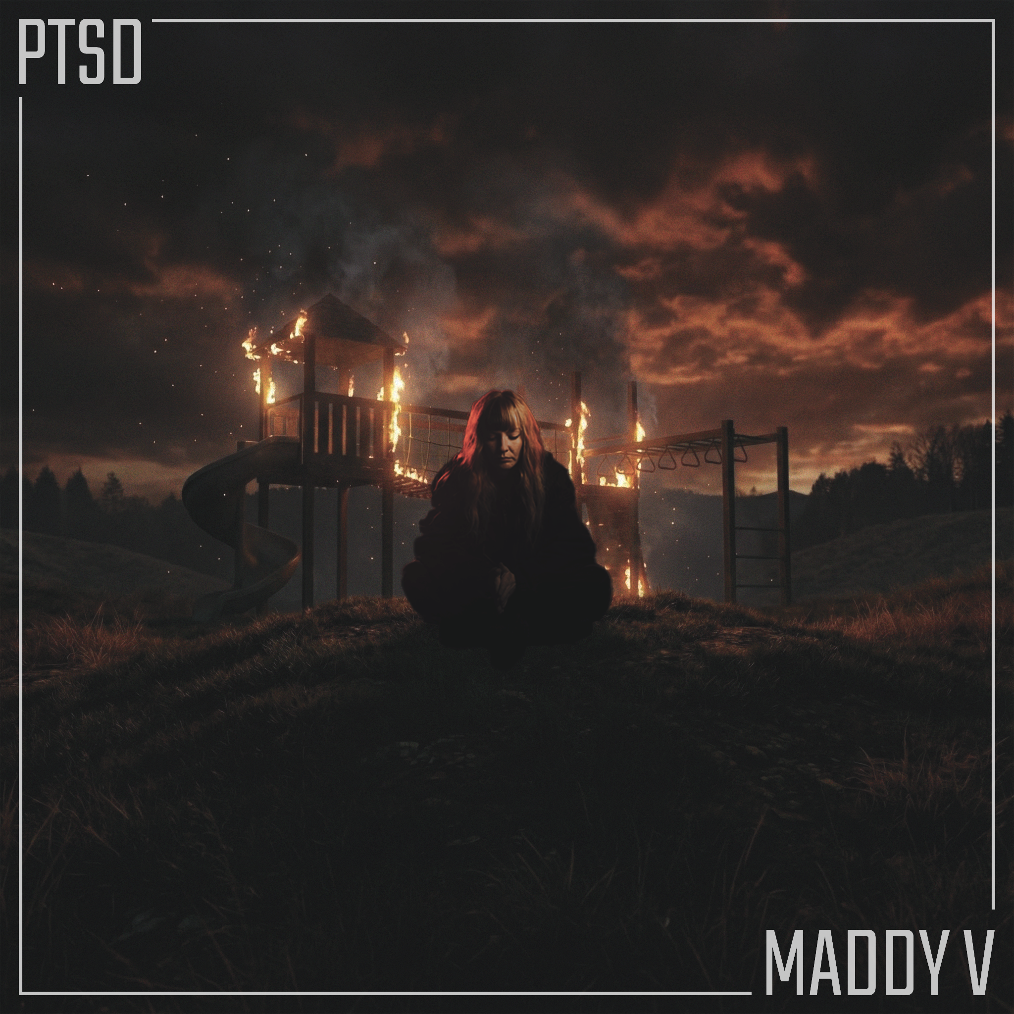 A person sitting in a dark field in front of a burning playground structure during sunset, with a cloudy sky overhead.