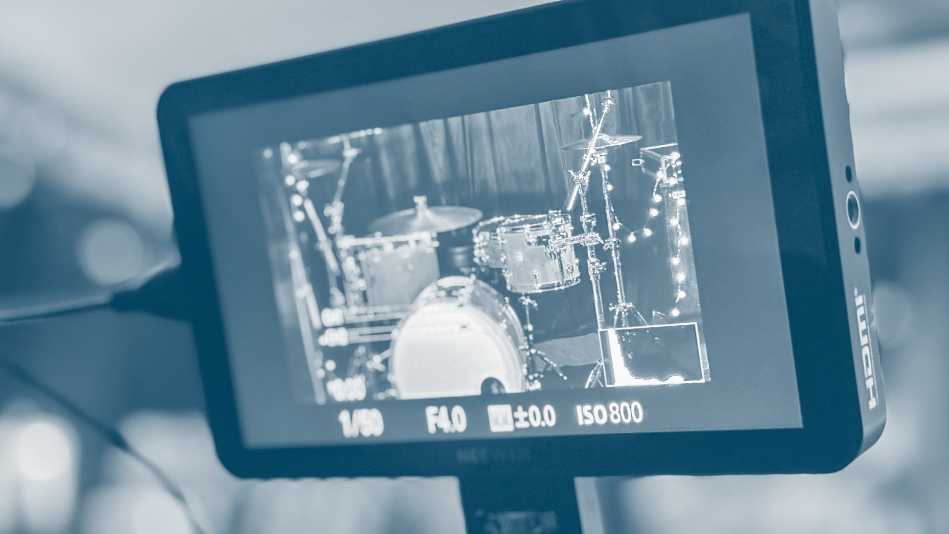 Close-up of a camera screen showing a drum set with drums and cymbals.