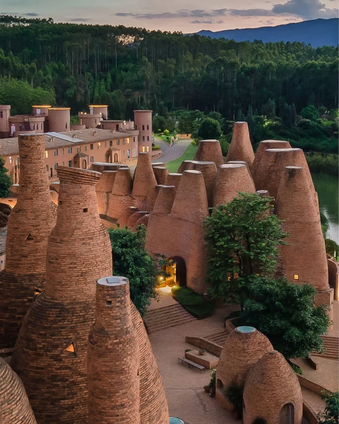 In Dongfengyun Town, Mile City, sculptor Luo Xu built a cluster of red brick domes that rise from Yunnan's red earth like a field of termite mounds. Constructed entirely from locally sourced brick, without a single steel bar or nail, the structures s