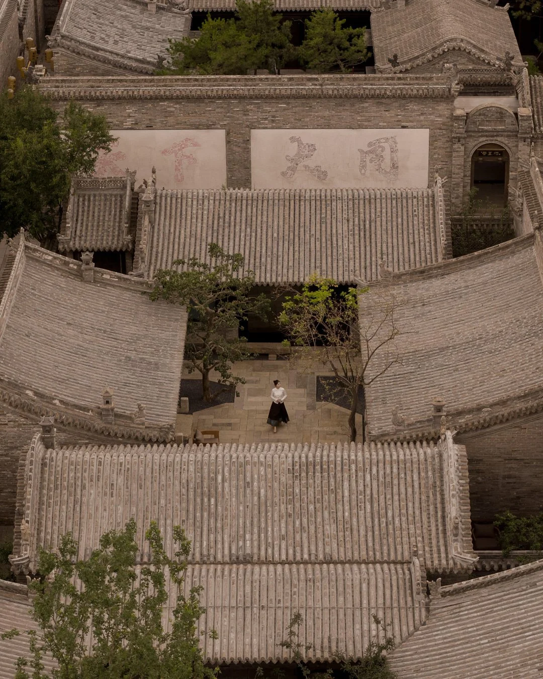 Sunyata Datong 既下山&middot;大同 has opened its second phase, Sunyata Pingcheng Compound 平城里坊, across seven historic courtyards in the southeastern quadrant of Datong's ancient city. The project spans 26 restored guest rooms arranged as a network of sepa