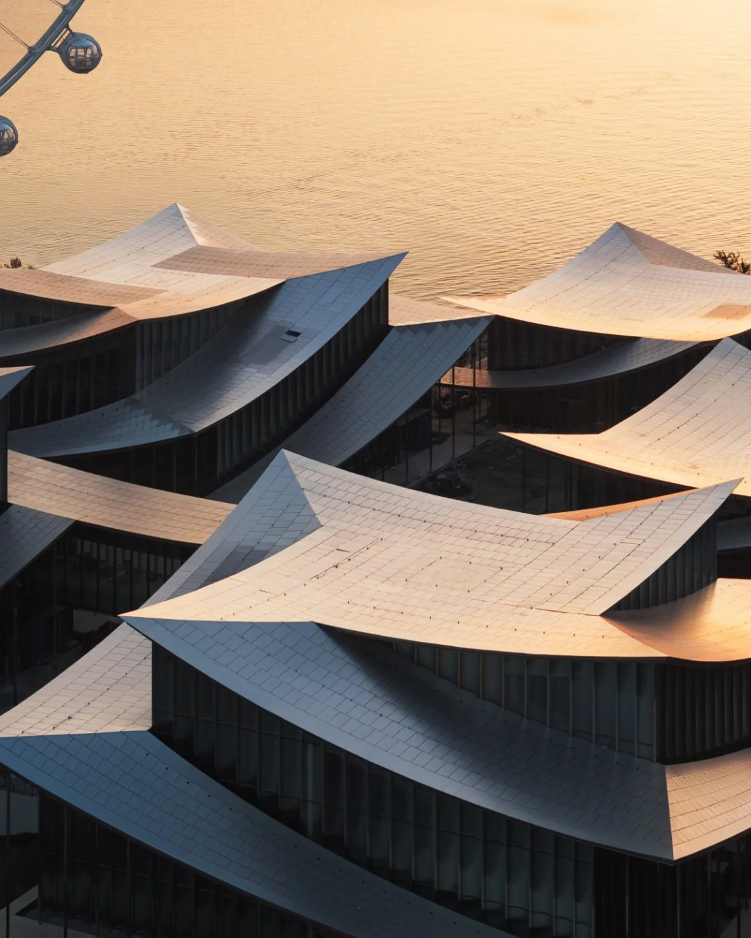 Suzhou Museum of Contemporary Art opened on August 30 along the Jinji Lake waterfront in Suzhou Industrial Park, a development district east of the city's historic core. The 60,000 sqm complex is BIG's first completed museum, designed with ARTS Group