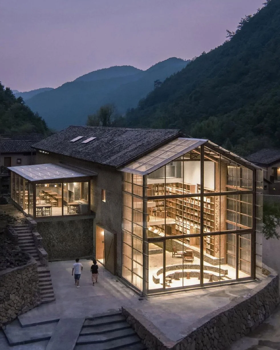 The Rural Capsule Hotel in a Library nestles deep in Qinglongwu Village, Fuchunjiang Town, Tonglu, Zhejiang, a repurposed century-old rural dwelling tucked within forested mountain valleys beside the Fuchun River watershed, the first rural capsule ac