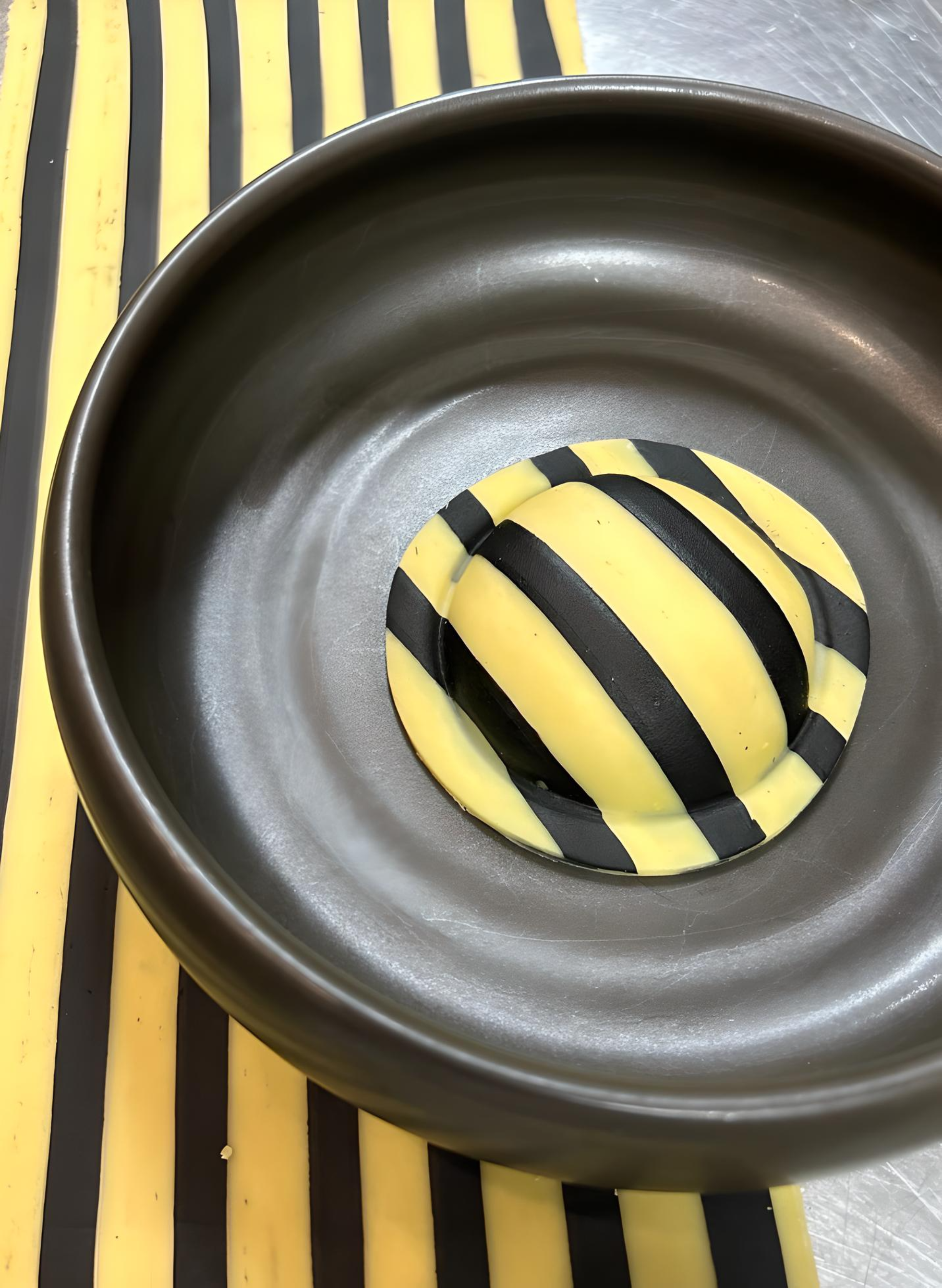 Squid Ink Striped Raviolo with a Lobster Chive Filling
