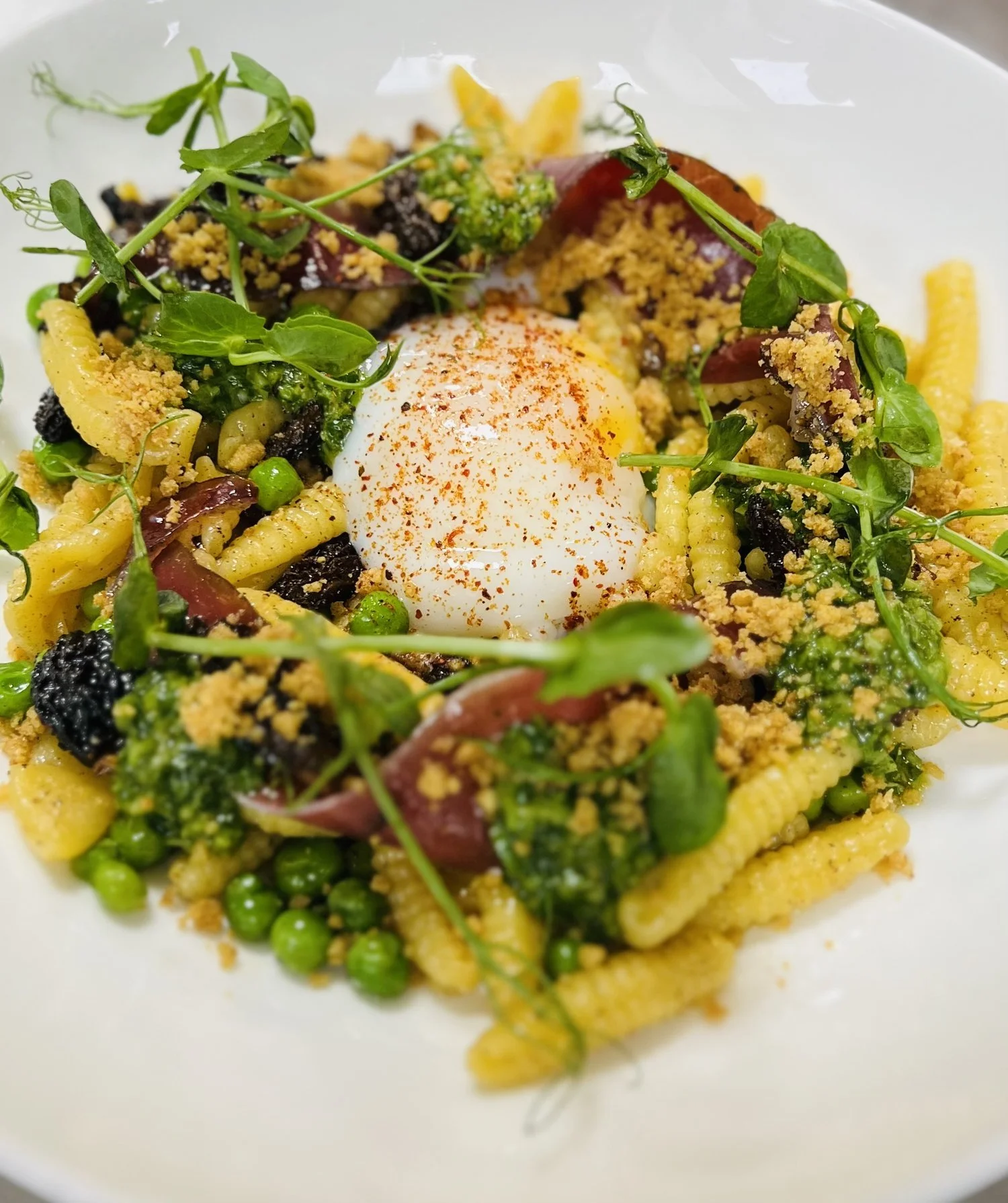 Cavatelli Pasta, Smoked Brown Butter, Morell Mushrooms, Crispy Prosciutto, Peas, Poached Egg Sprinkled with Espelette Chili Powder