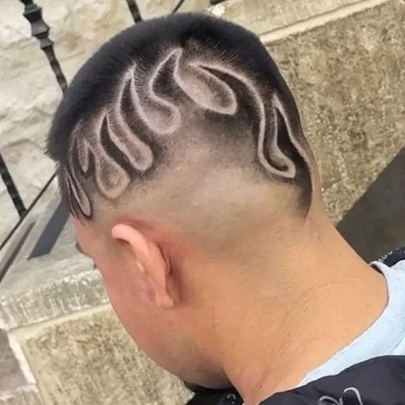 Haircut with intricate flame design