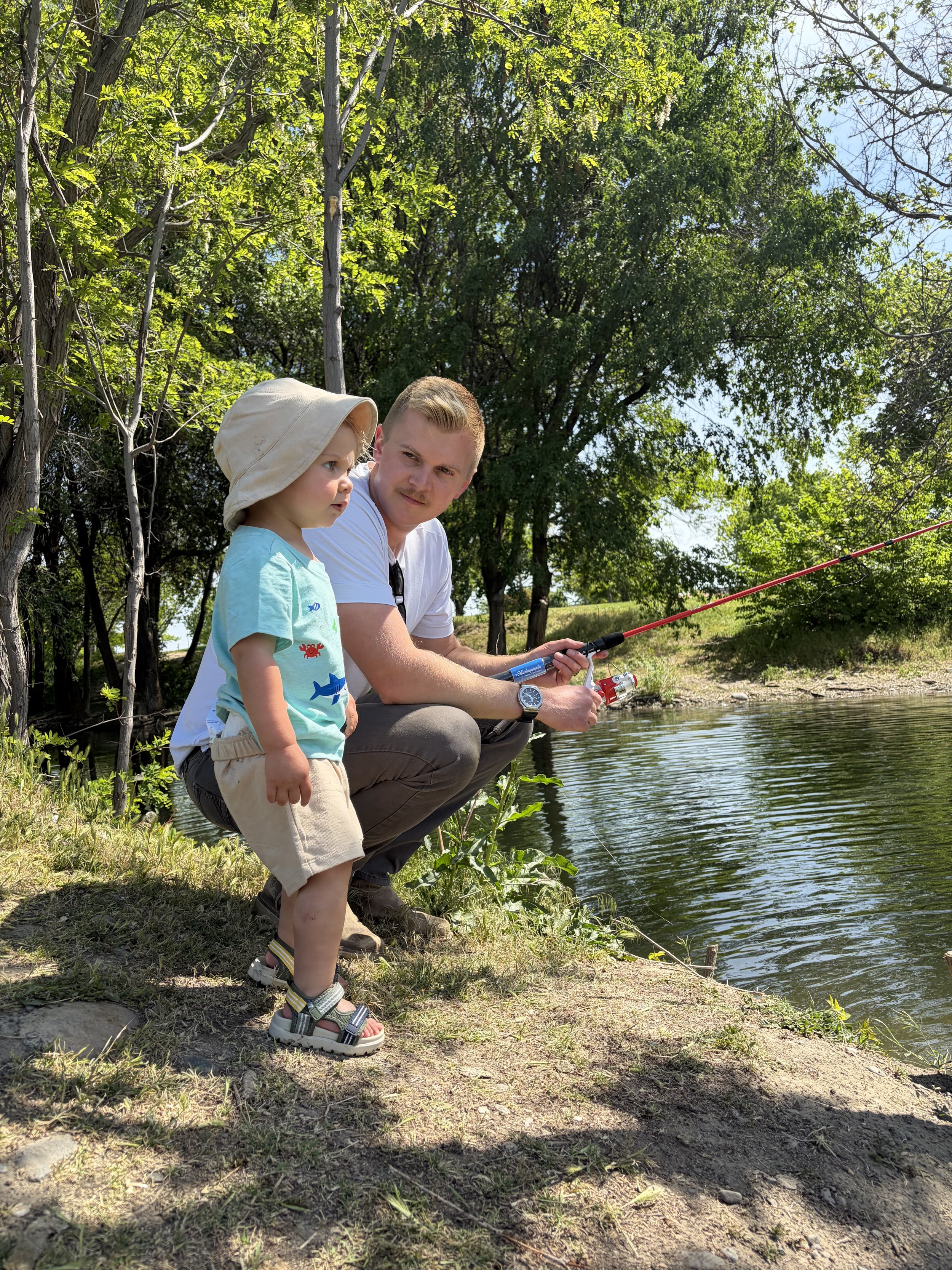 Jake, founder of Fellowship Construction, fishing with his son in the Pacific Northwest