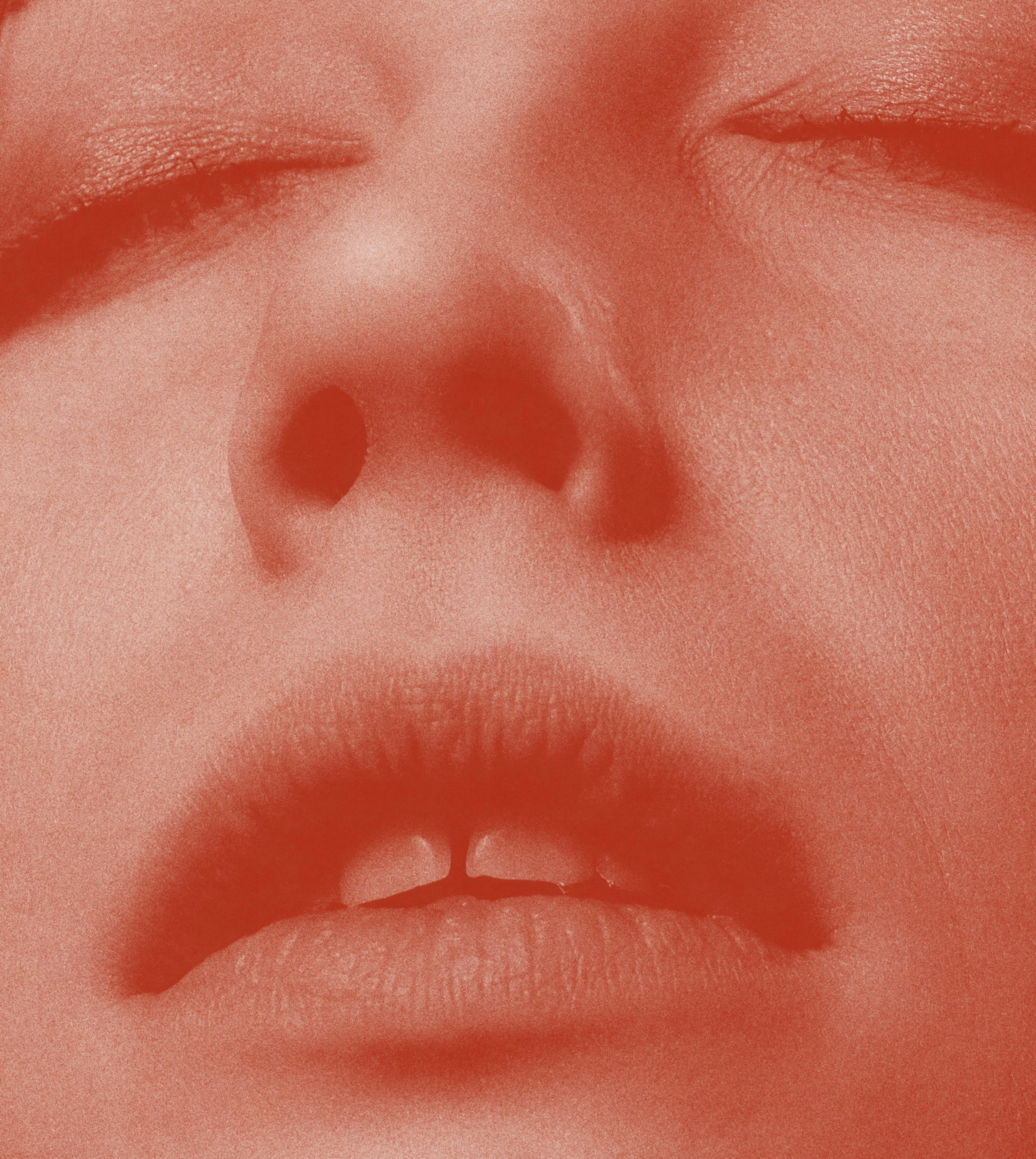 Close-up of a person's face focusing on their nose and lips.