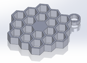 Three-dimensional metallic honeycomb mold with hexagonal cells and a small cylindrical extension on one side.