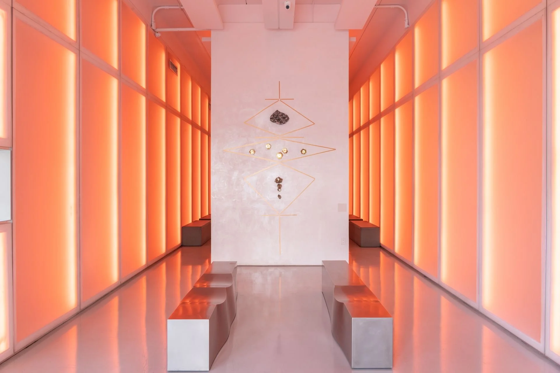 Architectural passage with illuminated panels at The Sacred Space Miami.