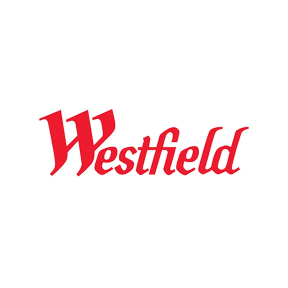 Red text that says "Westfield" on a white background. Tayla Stabile. Videography. Photography. Content creation. Adelaide videographer. Camera Operation. 