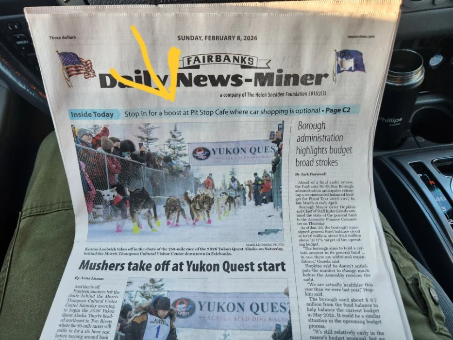 Front page of the Fairbanks Daily News-Miner dated Sunday, February 8, 2026, highlighting a business feature about Pit Stop Cafe in the Inside Today section.