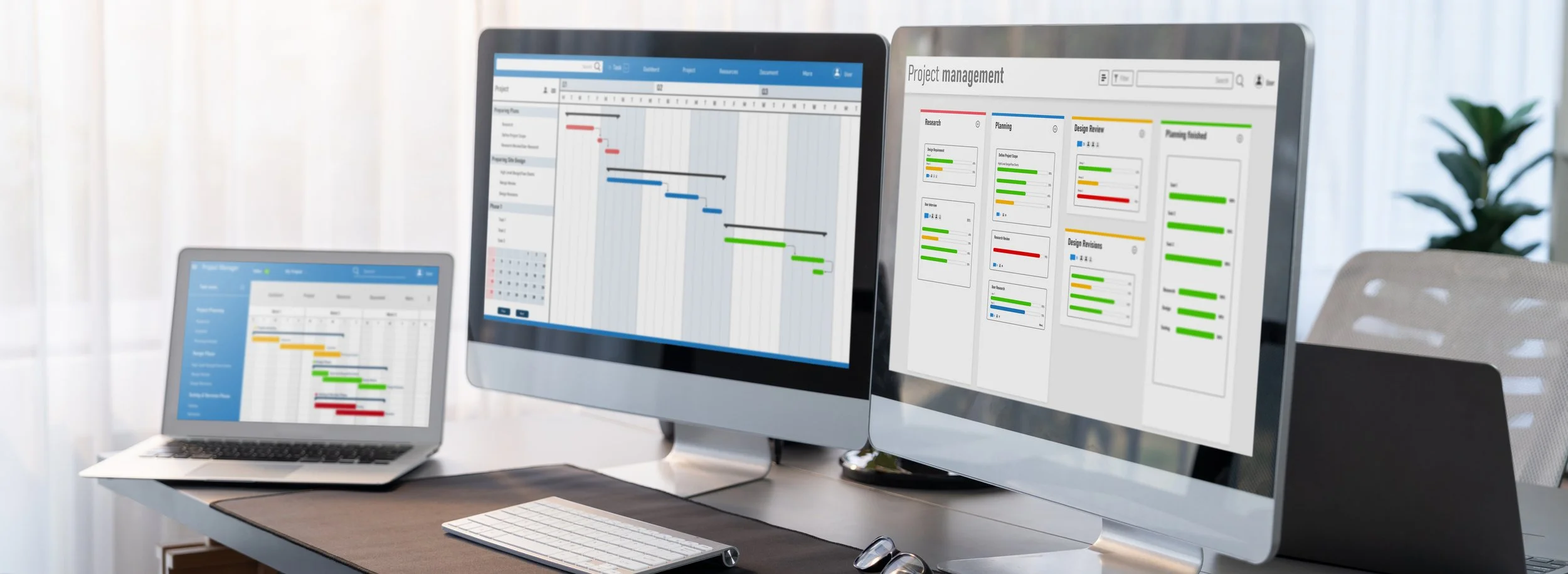 computer screens displaying project management software