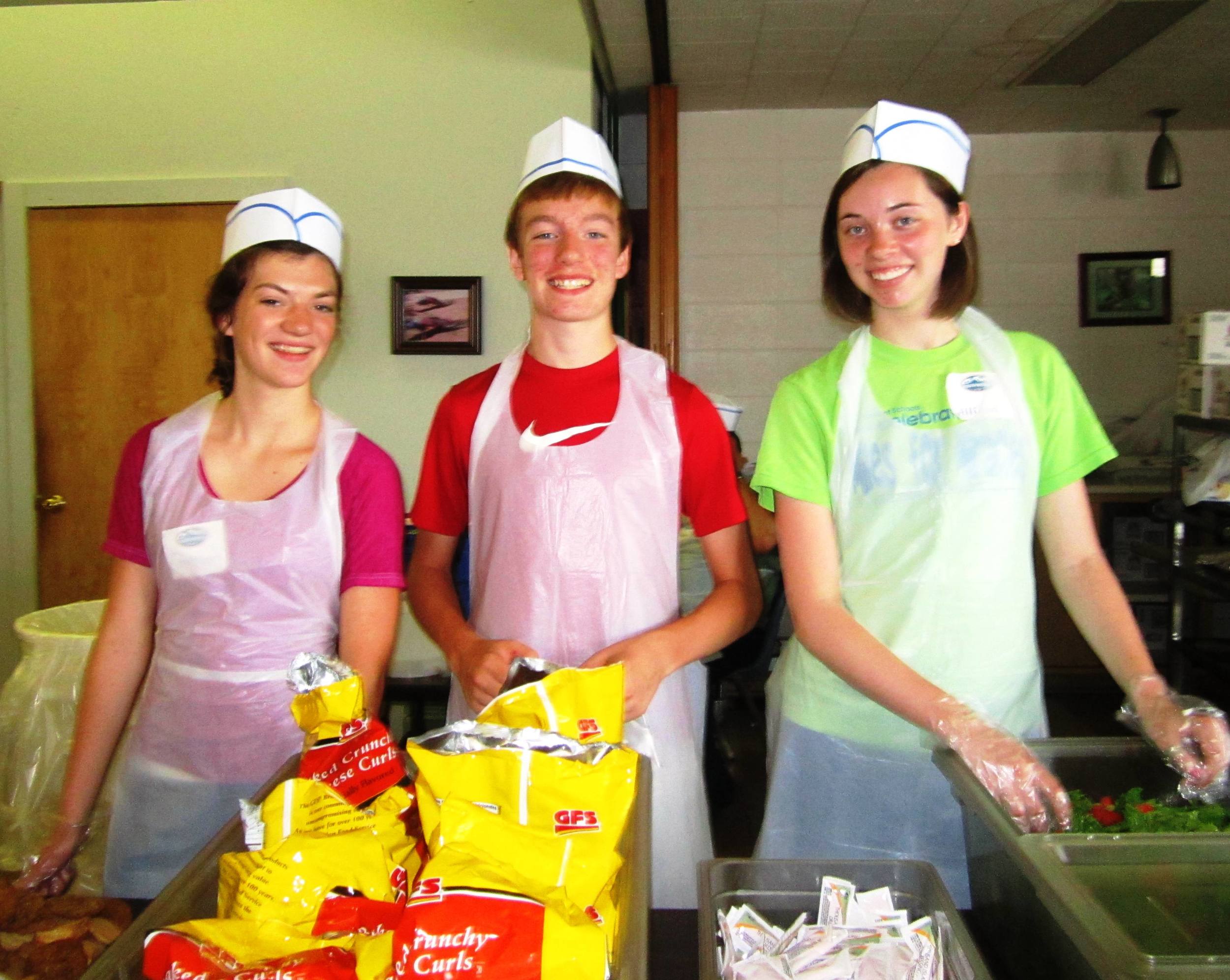 Youth Volunteers in the serving line at the Dinner Program