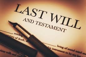 Close-up of a book titled 'Last Will and Testament' and a fountain pen.