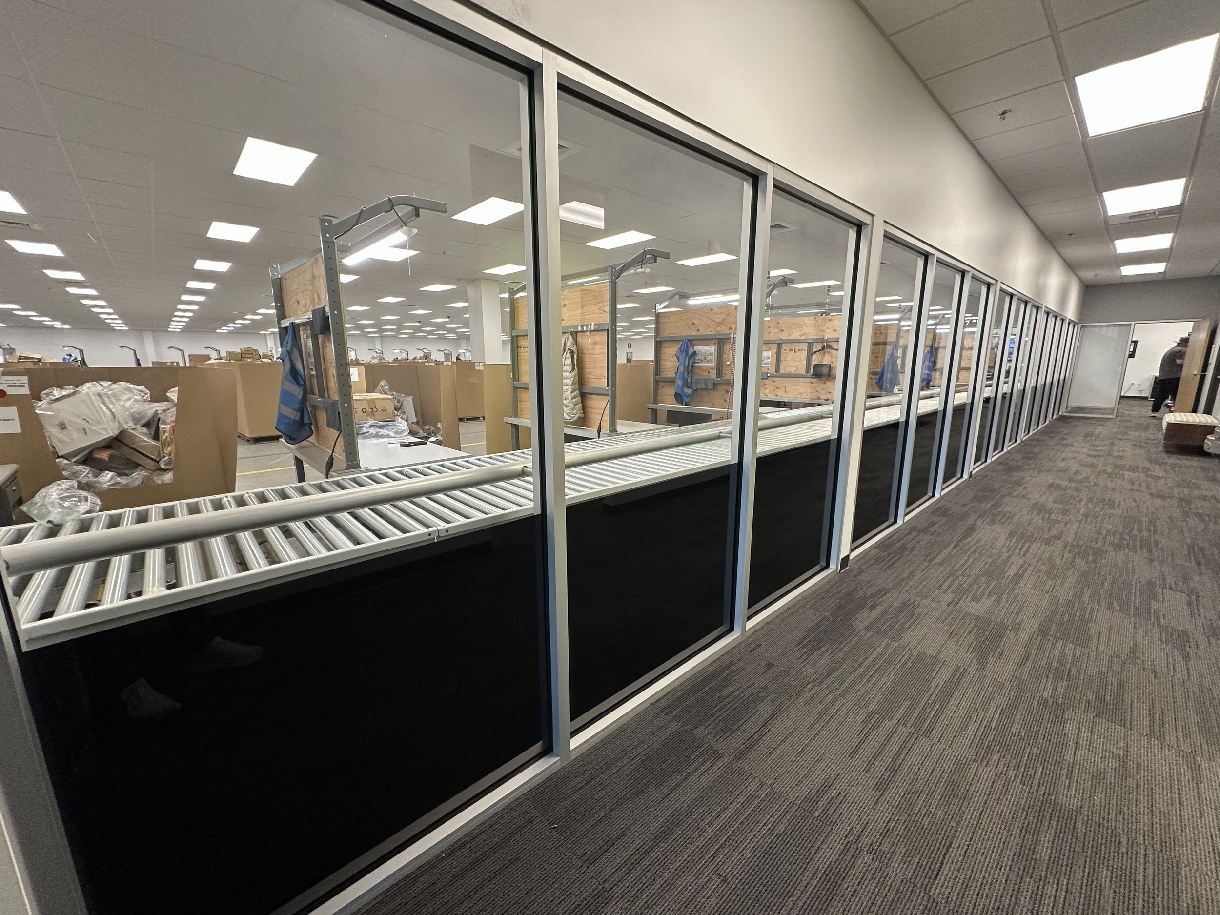 A hallway with windows that contain blackout Window Film 