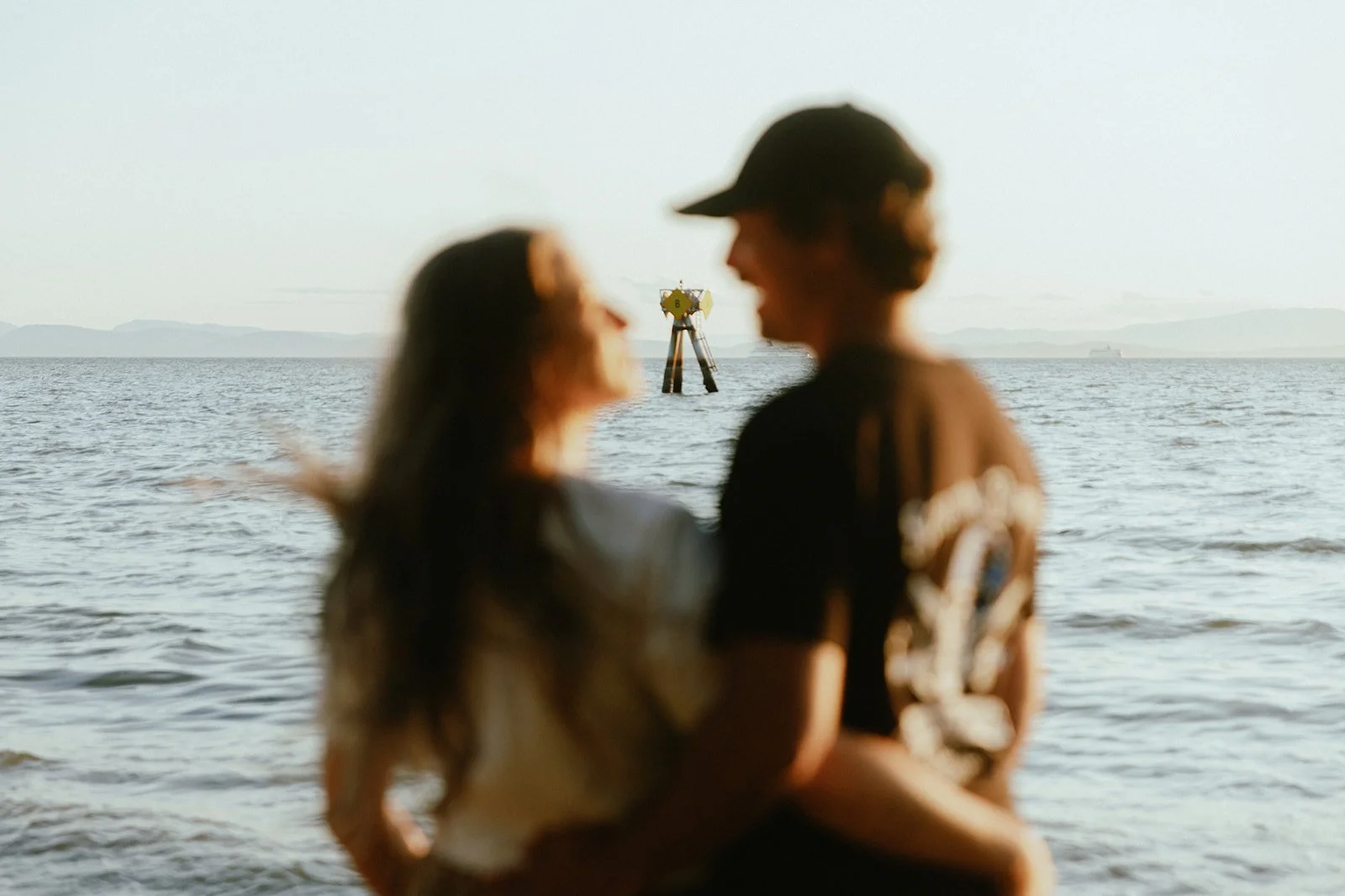Couple portrait on the beach with sunset