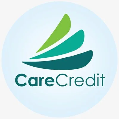 CareCredit logo featuring three overlapping green and teal shapes above the brand name "CareCredit" in green and teal text.
