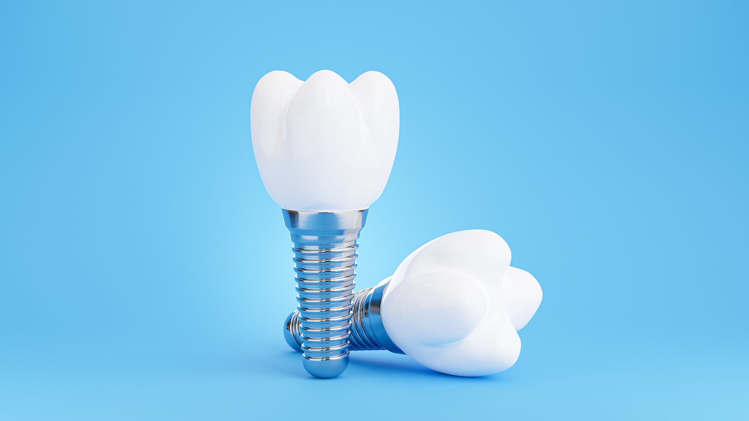 Dental implant resembling a tooth against a blue background.