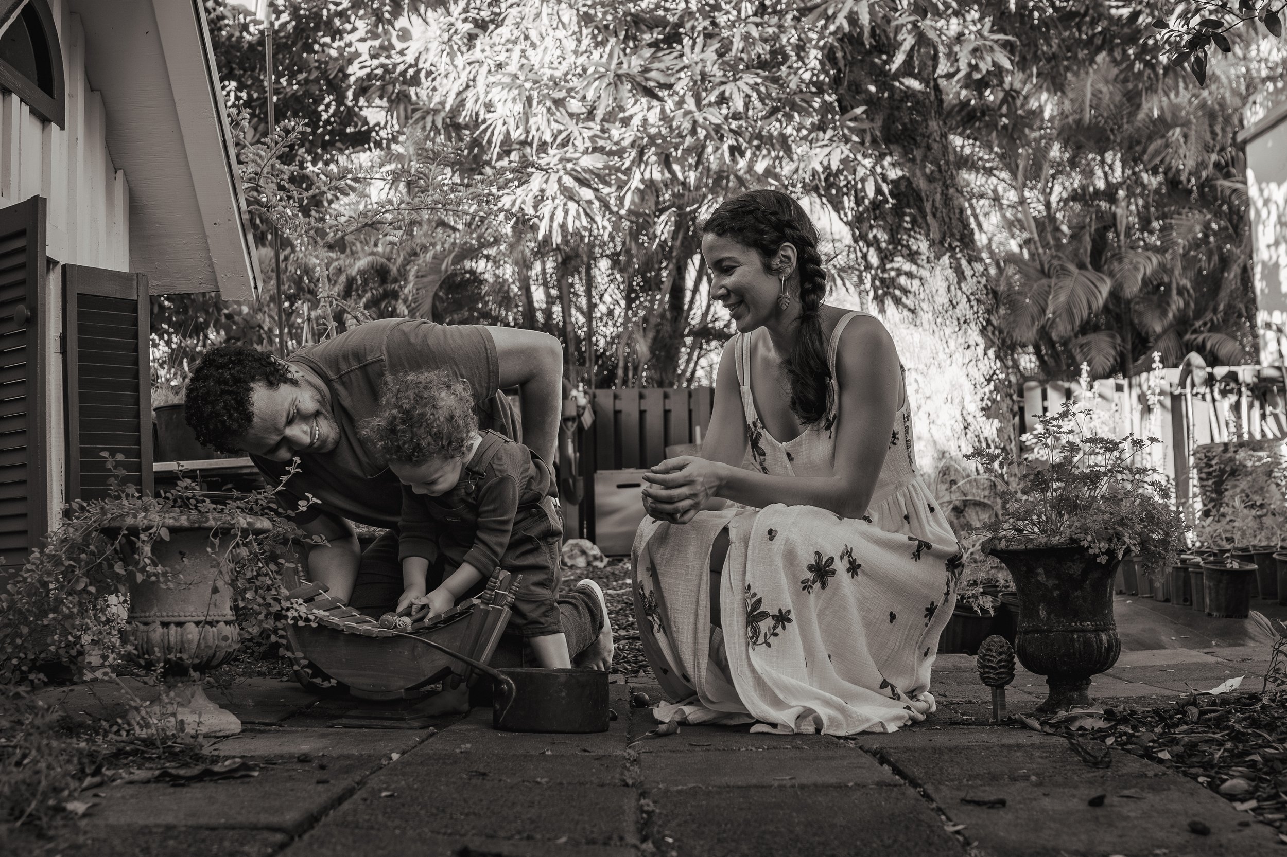 Mom watches Dad and Child Play