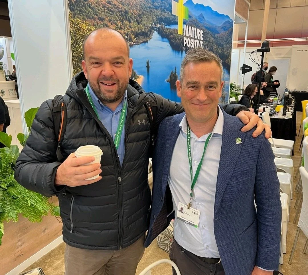 Paul Dettmann stands with friend at COP 15