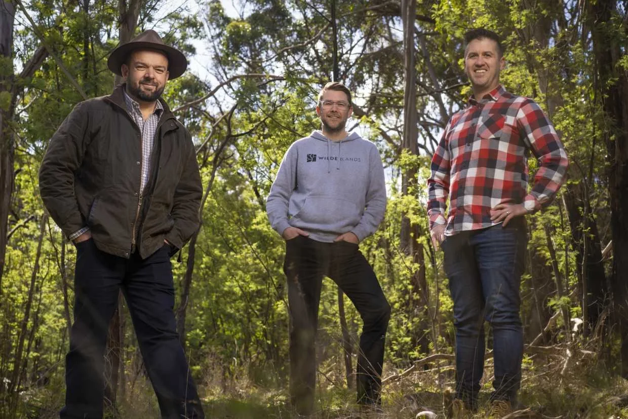 Paul stands alongside Ash Knop and Heath Evans, founders of Wilderlands