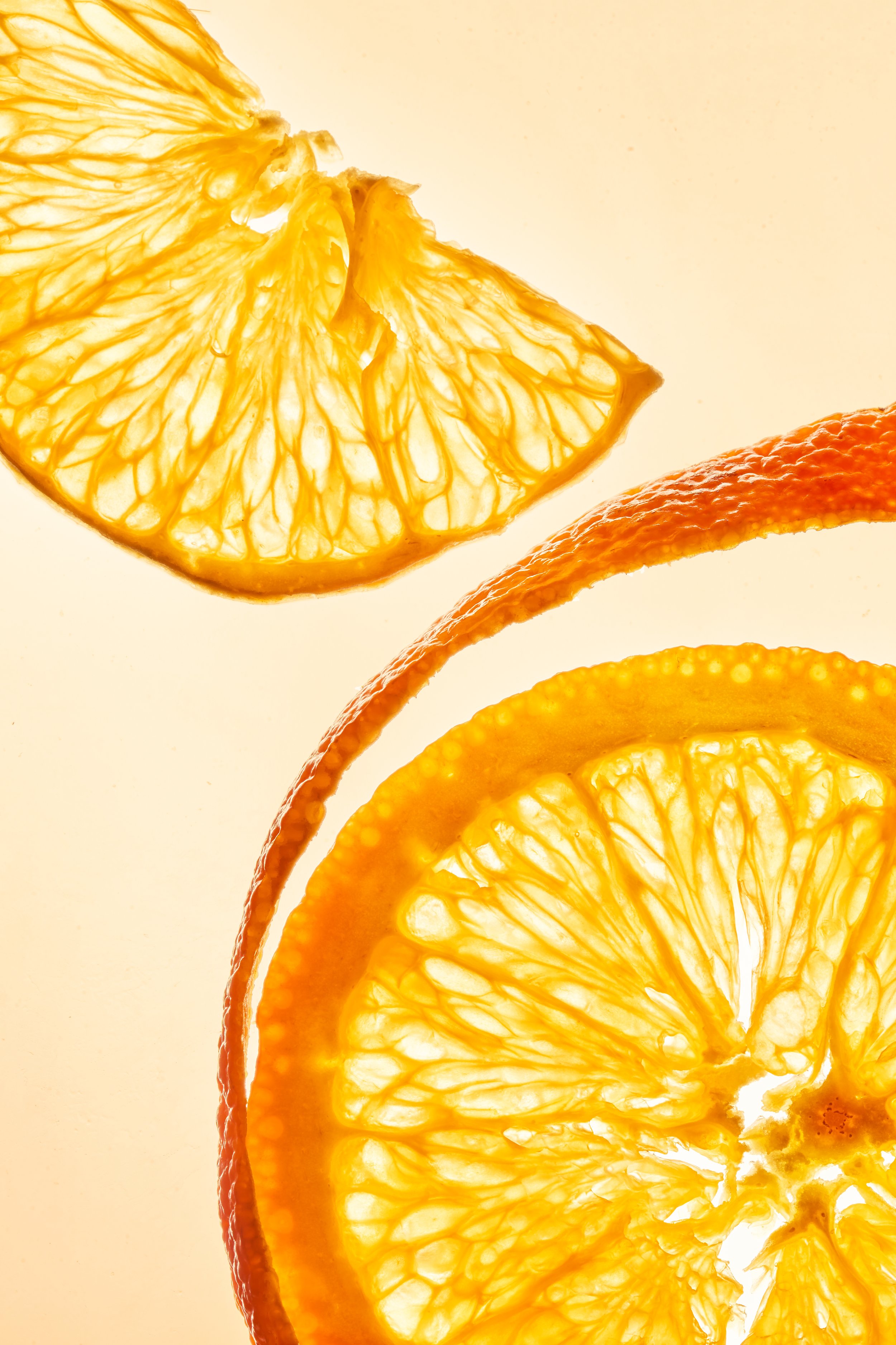 Close-up of orange and lemon citrus slices showing their interior flesh and texture.