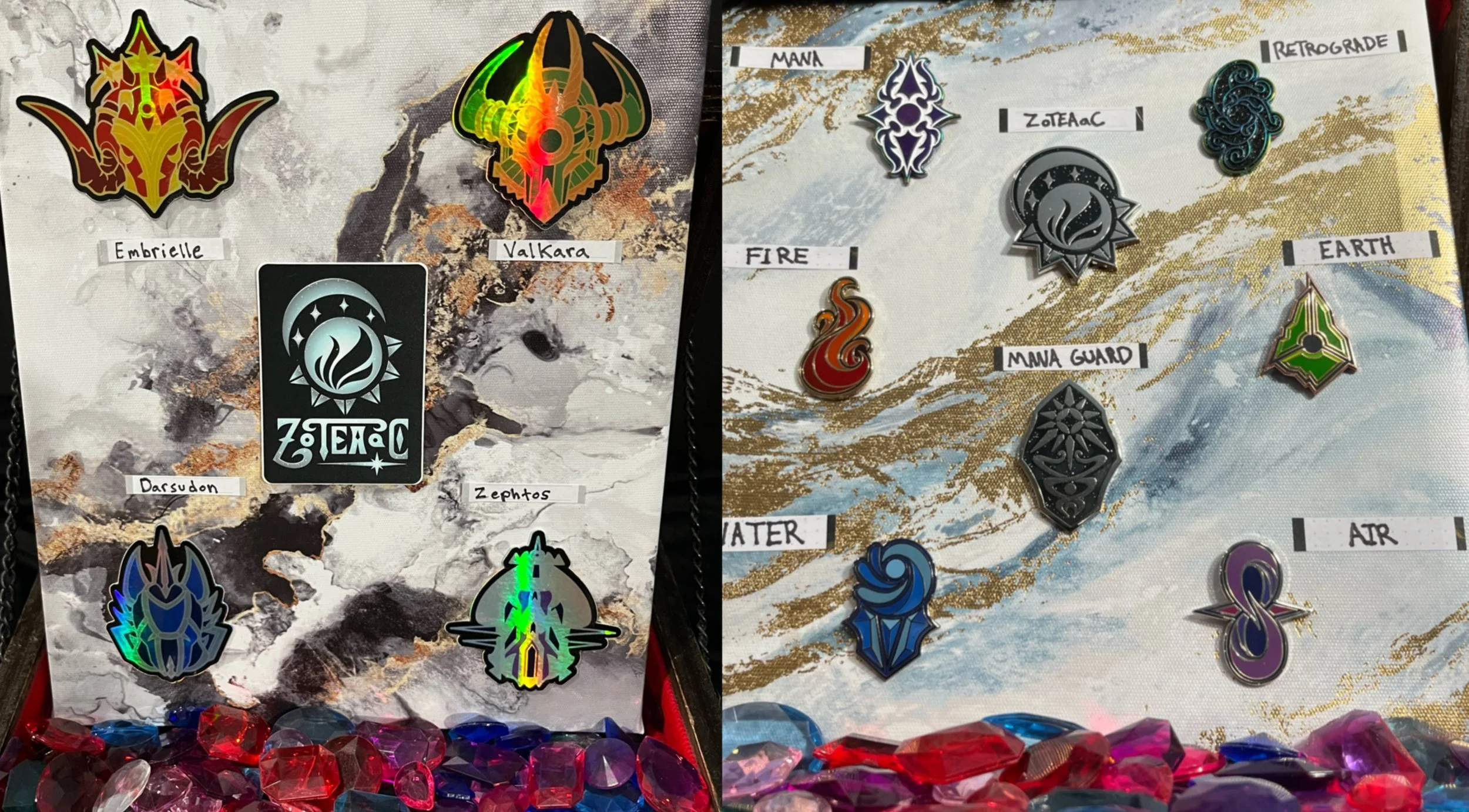 Holographic Sticker set of the Ancients helmet designs. Enamel pin set of the Elemental logos and ZOTEAAC story logos.