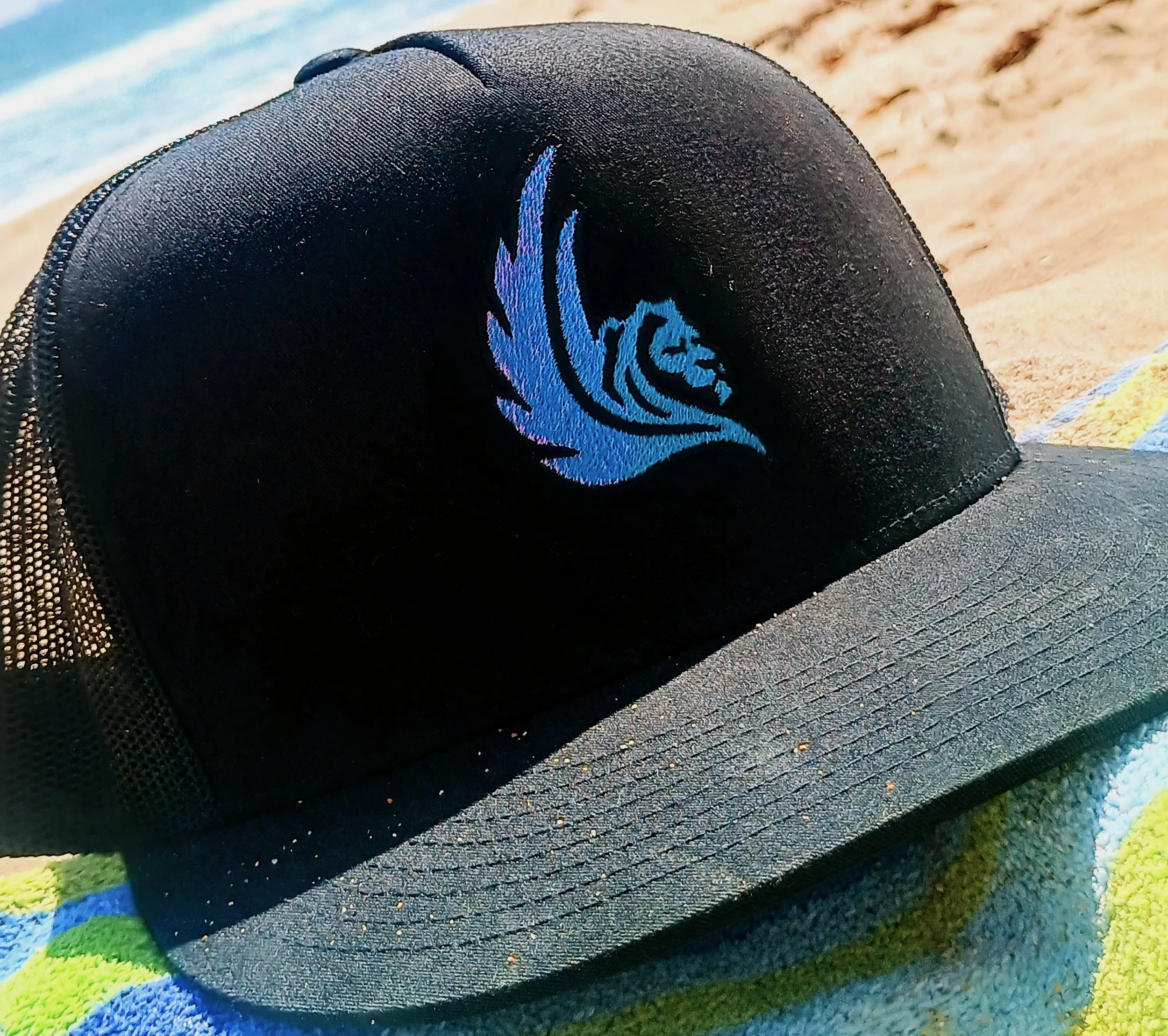 Elixir logo of Ceraph, embroidered on hat.