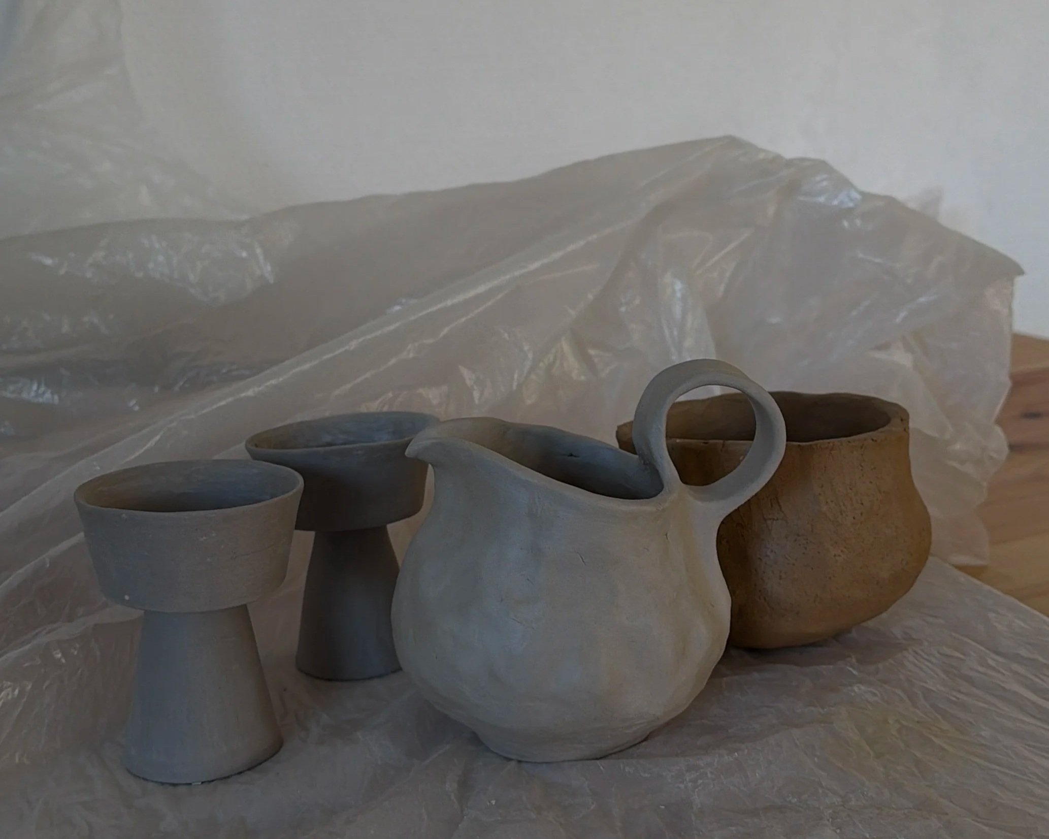 The breaking bread set before it went to through the fire, raw clay