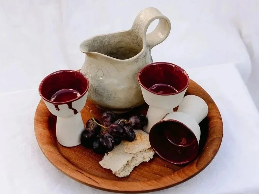 Handmade stoneware cups and jug with natural glazes and dark red  for everyday rituals