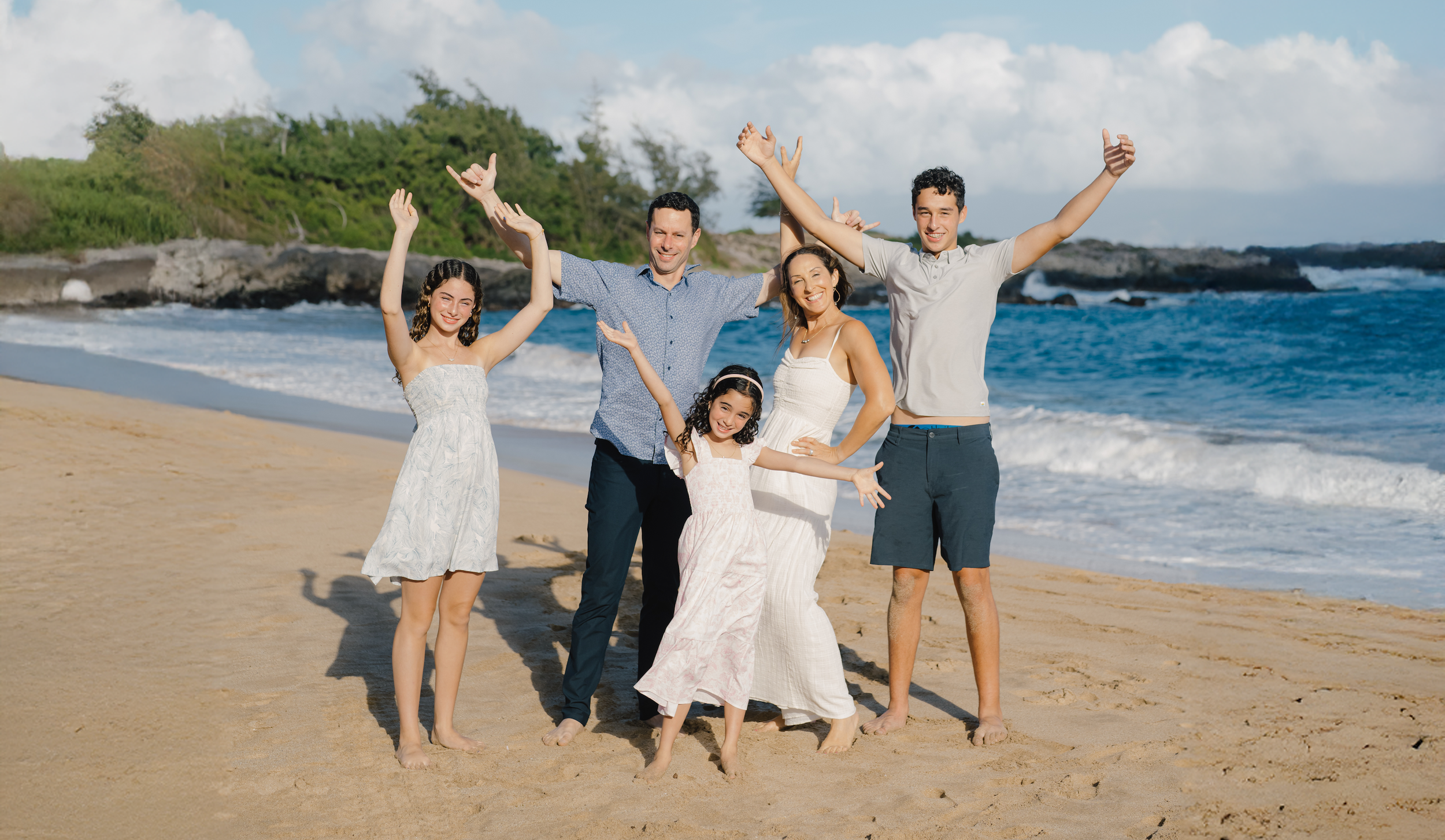 Esther Levy, MSc, NBC-HWC, Certified Intuitive Eating Counselor, CEO & Founder of Ohana Health Coaching and Consulting, with her family on the beach in Hawaii