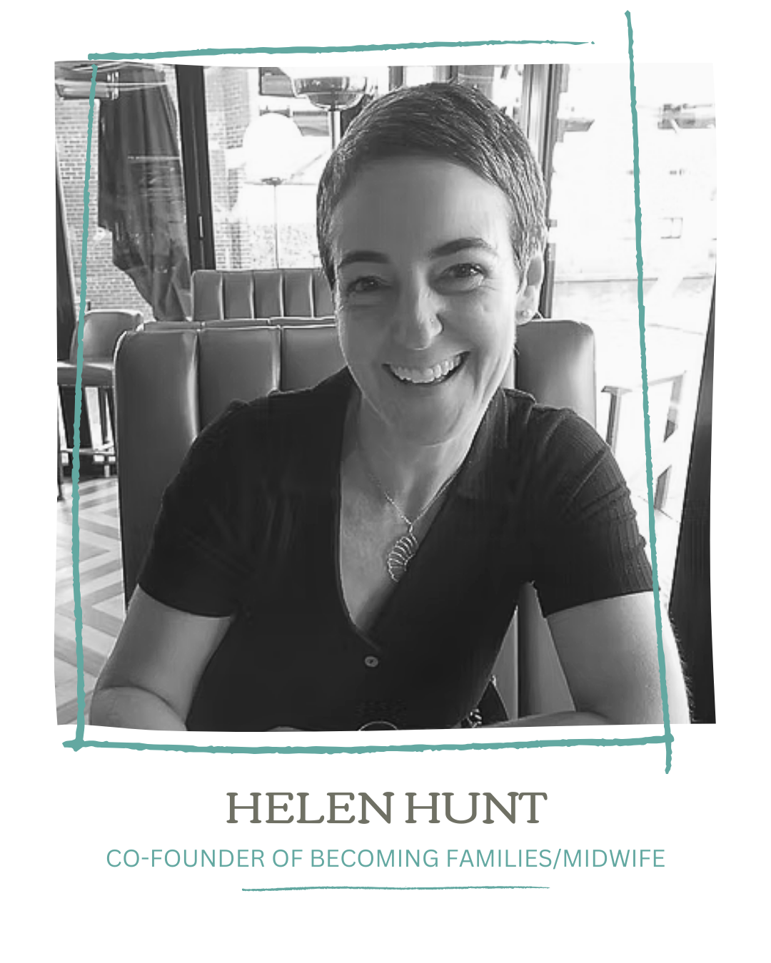 A black and white photo of Helen Hunt smiling, sitting in a restaurant with large windows and modern decor, wearing a dark top and a necklace.