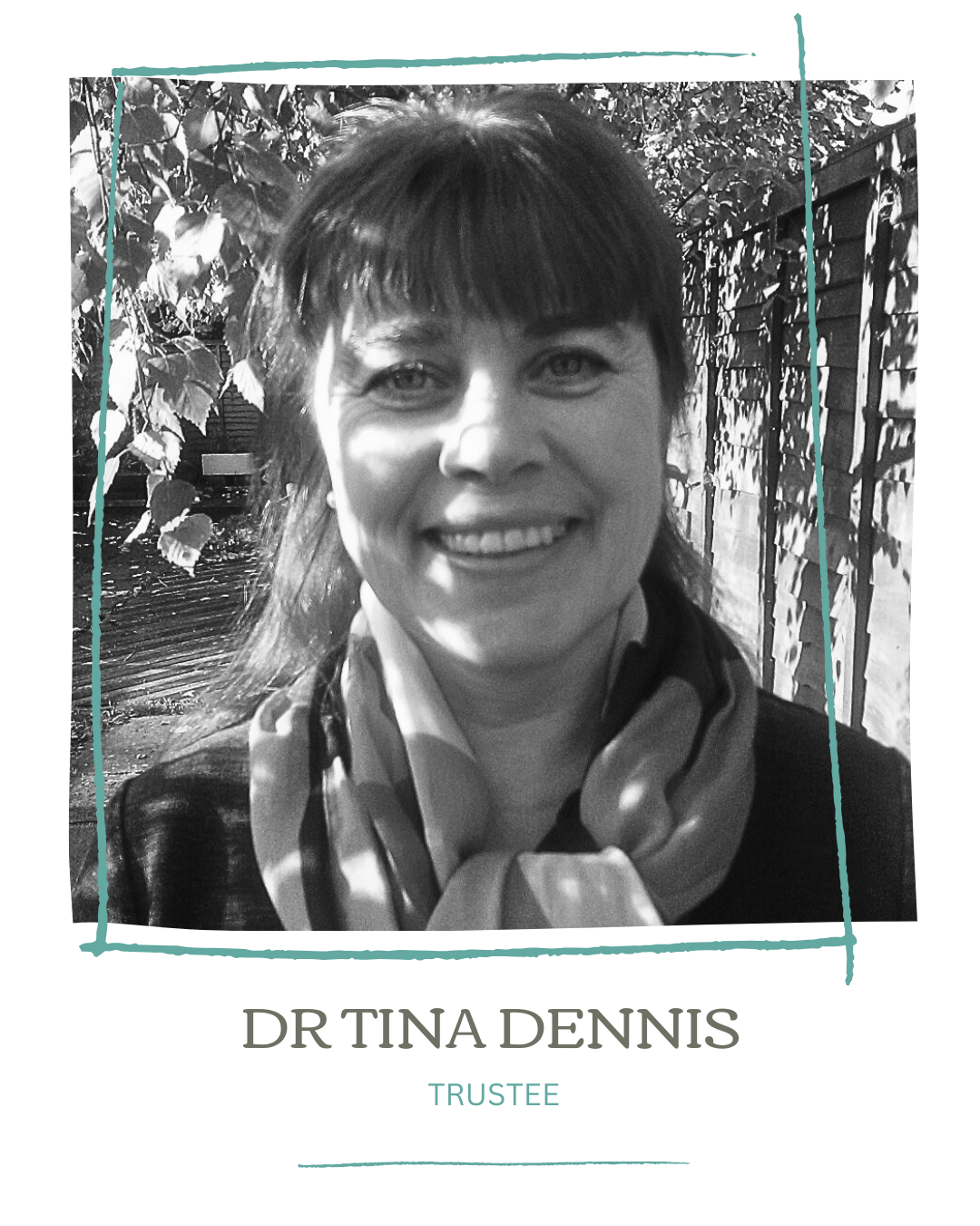 Black and white portrait of Dr. Tina Dennis smiling outdoors with leaves and a wooden fence in the background, wearing a scarf and dark jacket, with the text "Dr. Tina Dennis, Trustee" below.