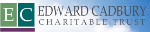 Logo of the Edward Cadbury Charitable Trust with green and purple squares and text on a cloudy sky background.